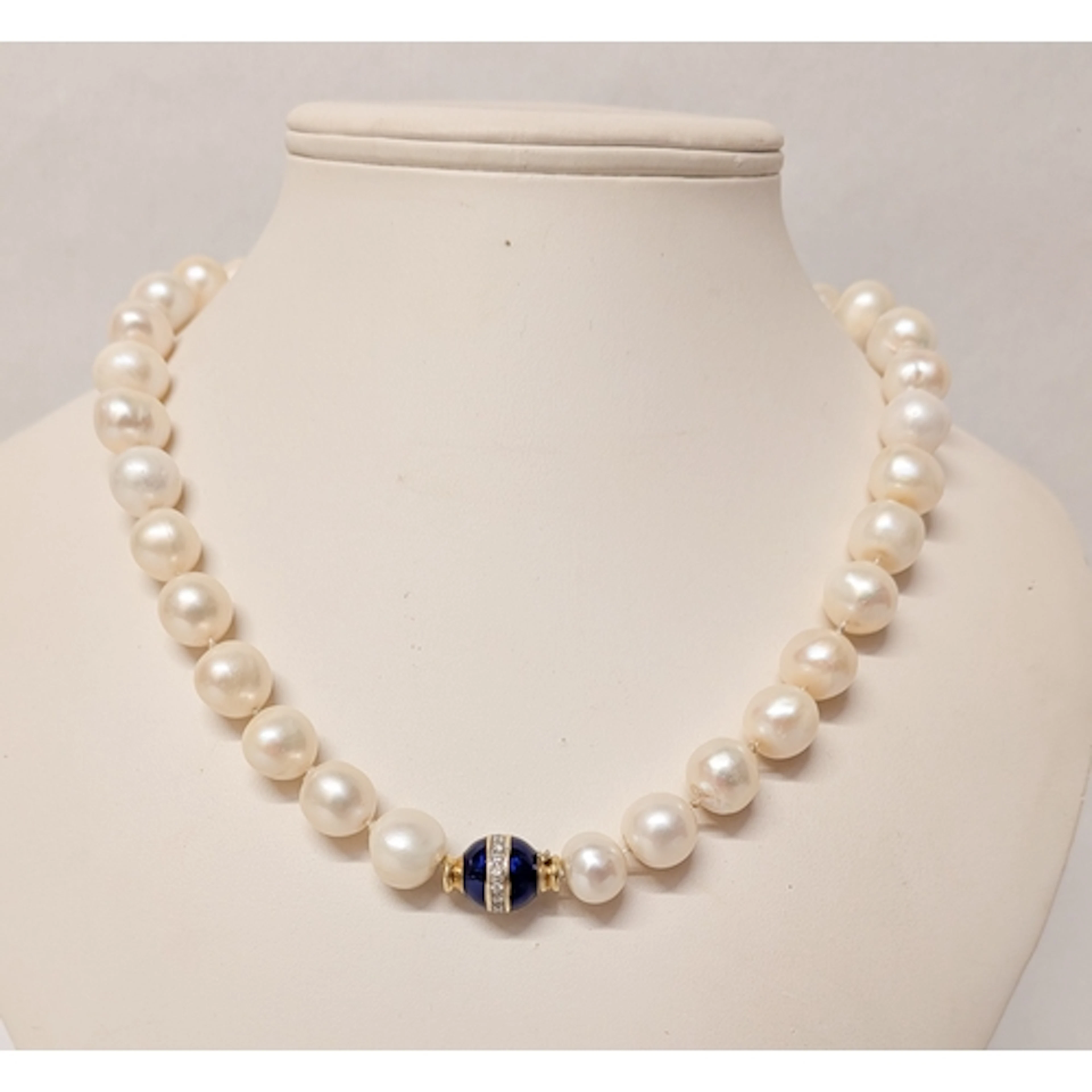 Large row of cultured pearls with blue enamel and diamond se...