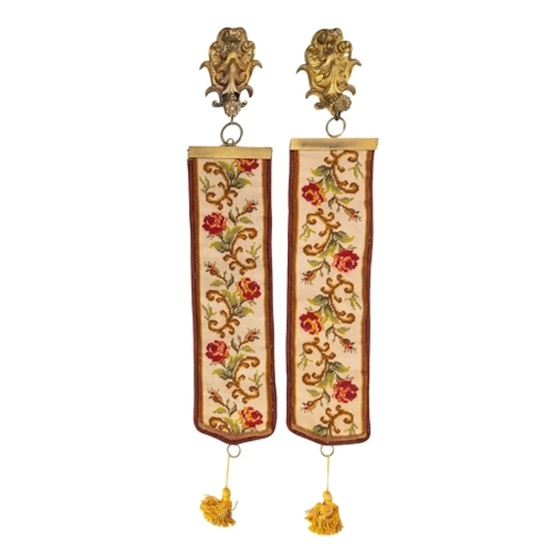 A pair of Berlin woolwork and gilt bronze mounted bell-pulls...
