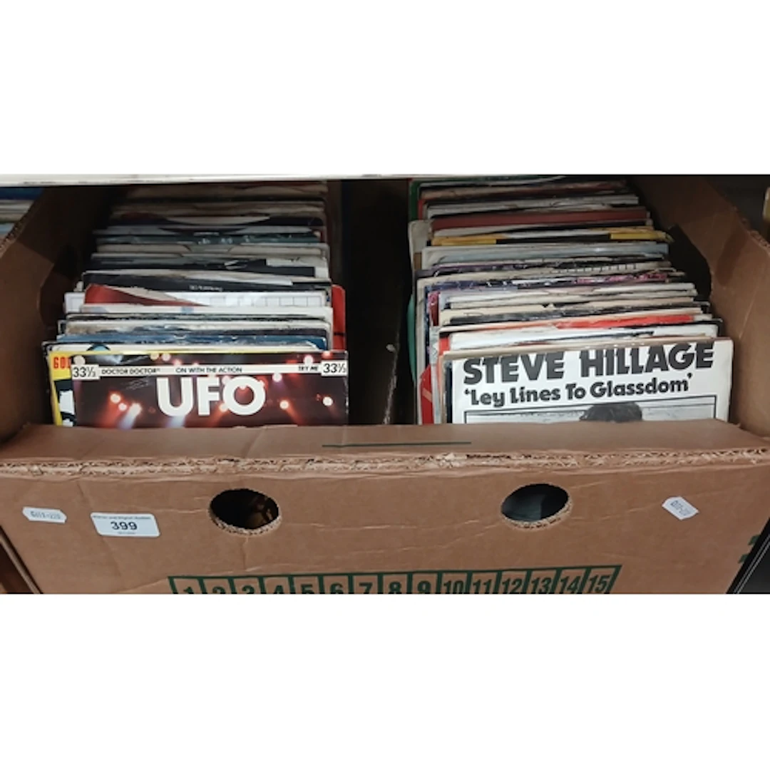 A box of assorted rock, prog, folk & metal 7" vinyl single r...