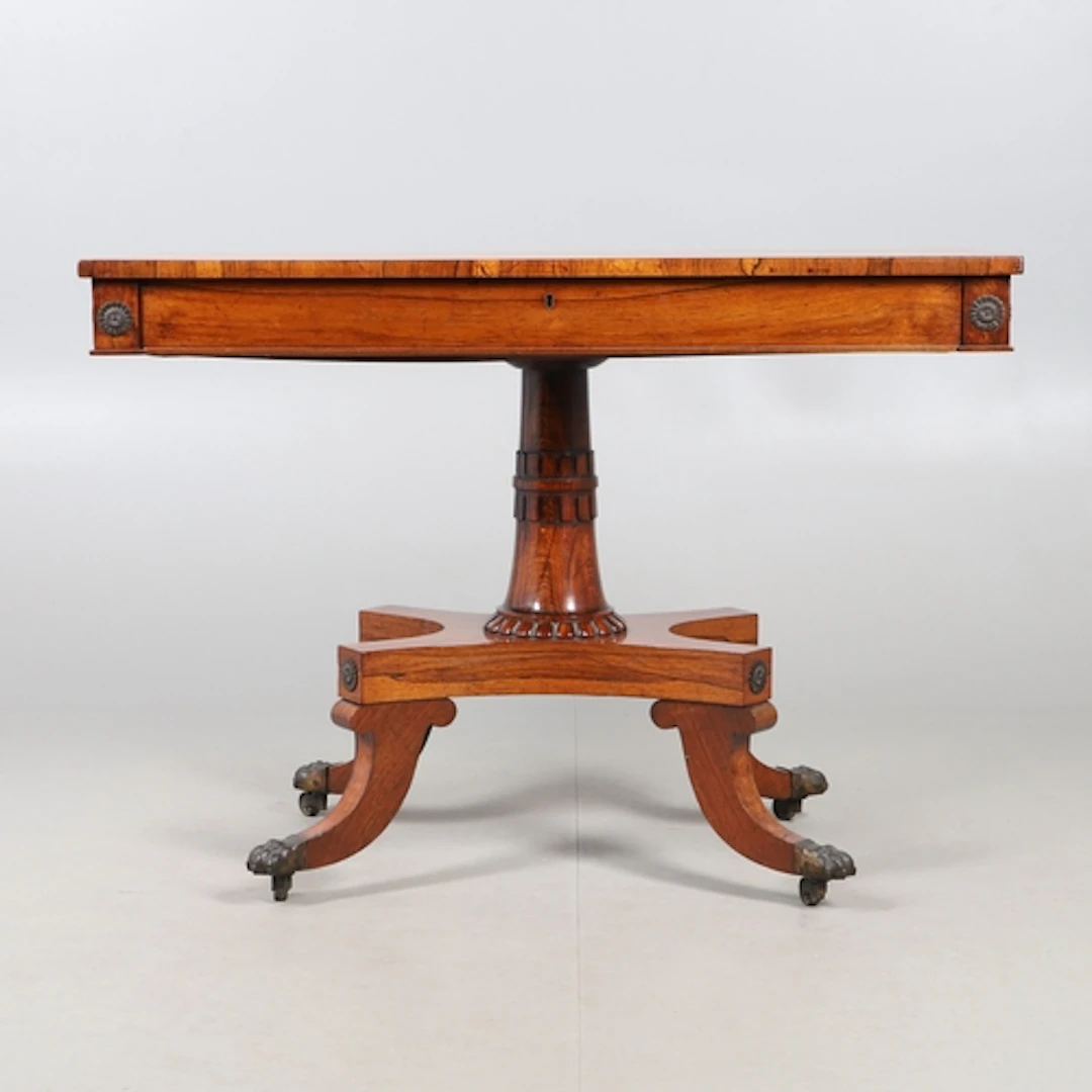 A LATE REGENCY ROSEWOOD AND BURR WOOD PEDESTAL TABLE. the re...