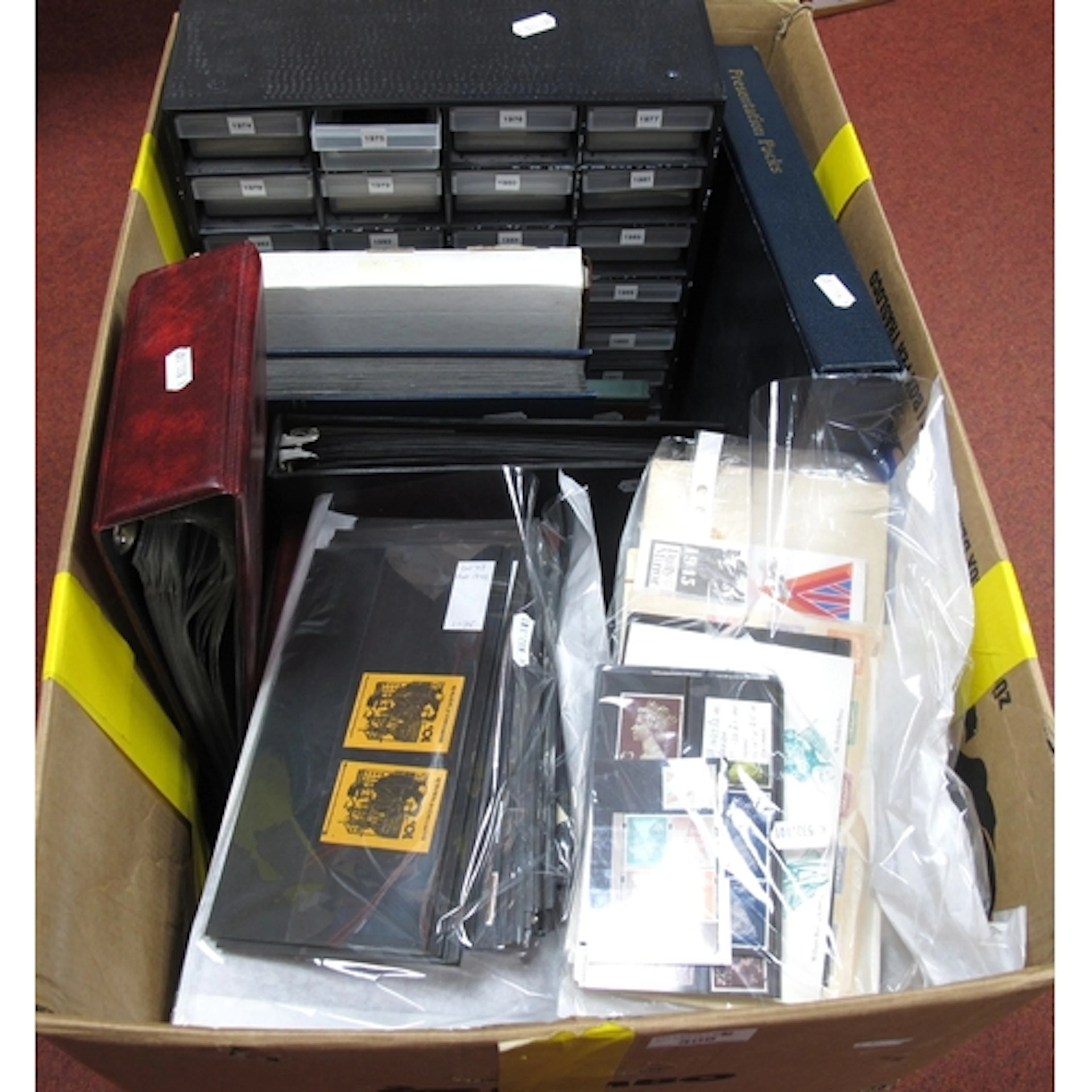 Stamps: An accumulation of GB and World stamps, plus over 24...