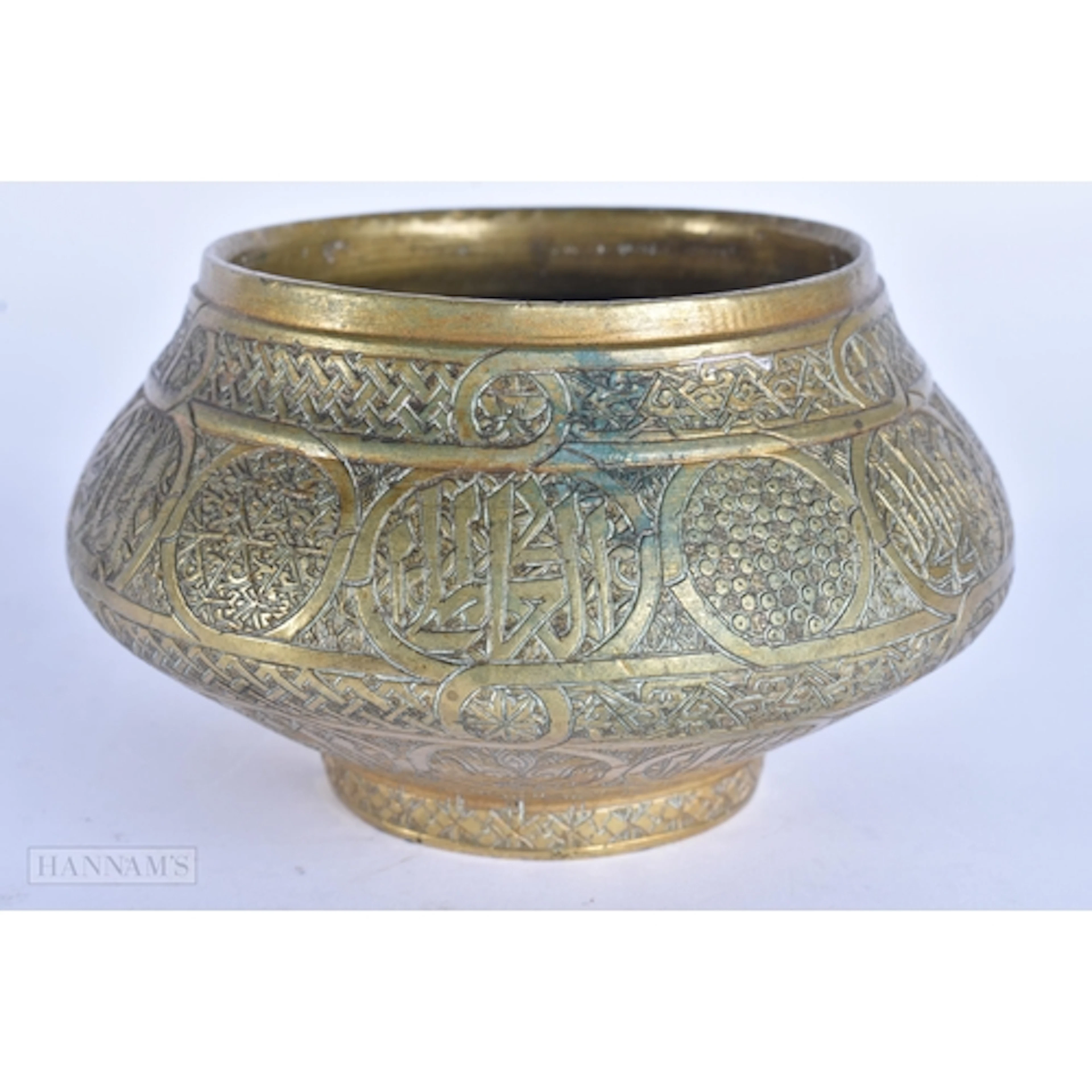 A 19TH CENTURY MIDDLE EASTERN ISLAMIC BRONZE CENSER decorate...