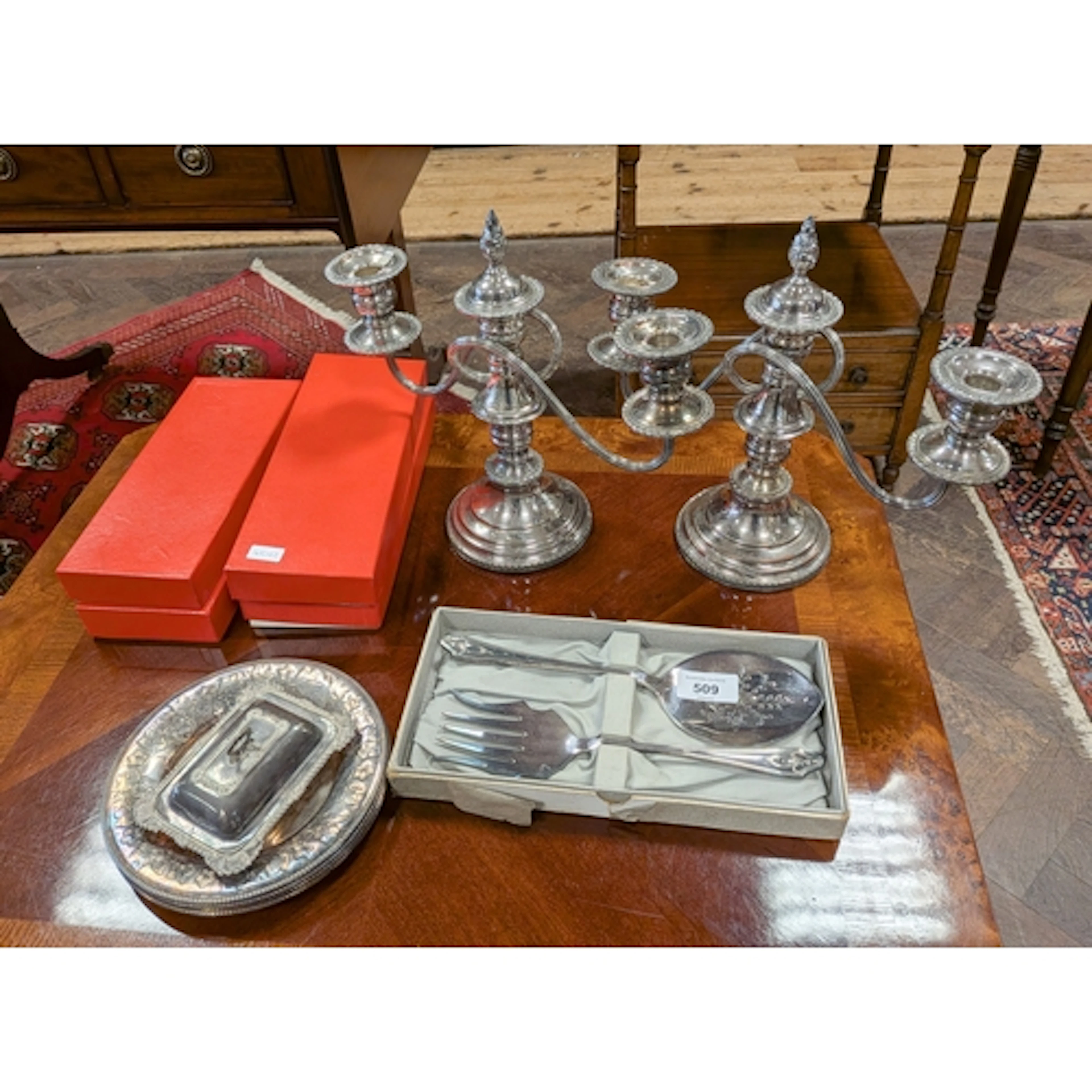 A pair of silver plated table candelabra together with servi...
