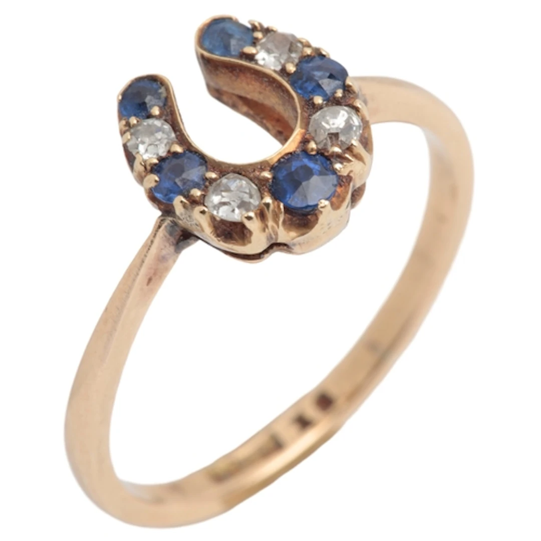An Edwardian sapphire and diamond ring, designed as a horses...
