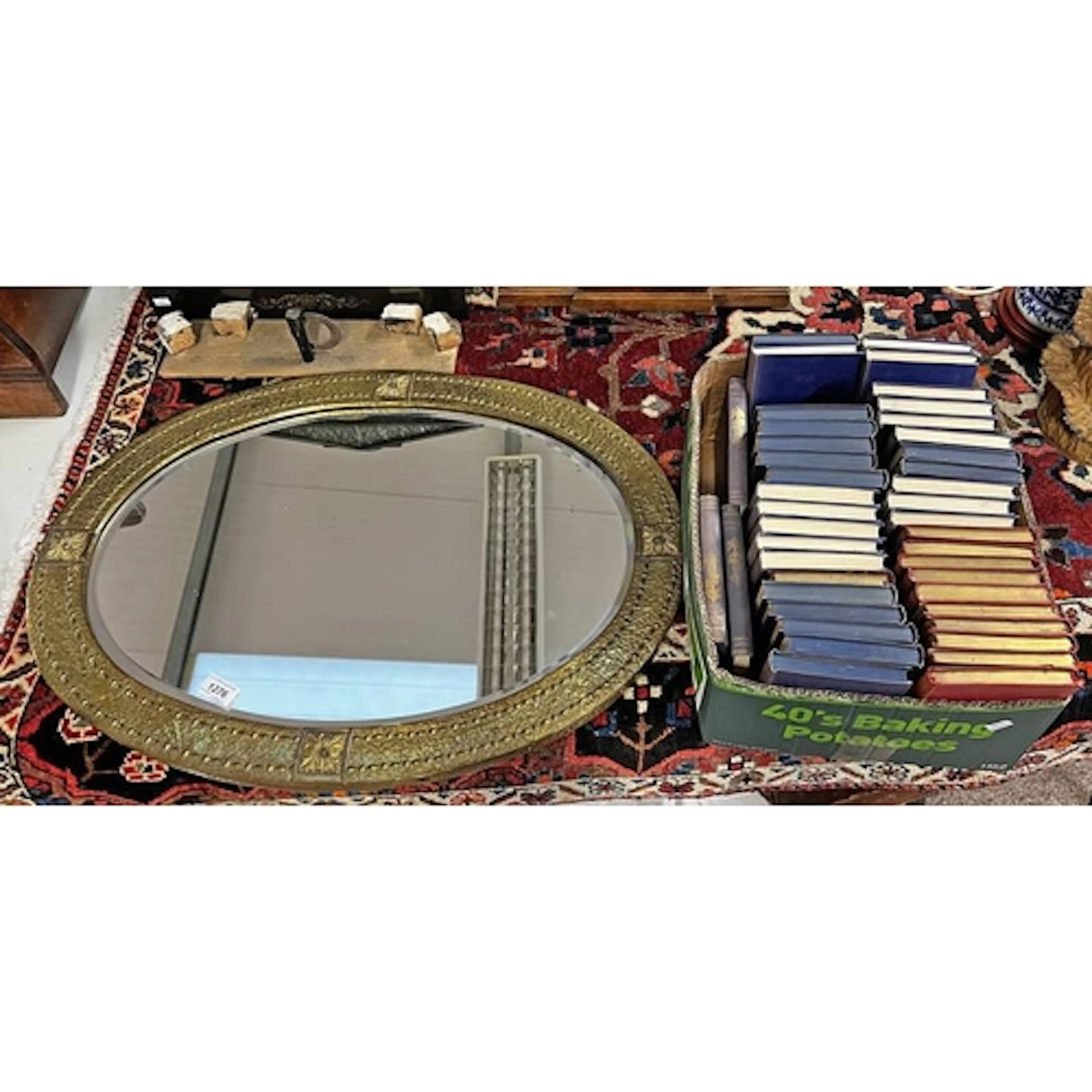 OVAL MIRROR WITH BRASS FRAME ALONG WITH A SELECTION OF BOOKS...
