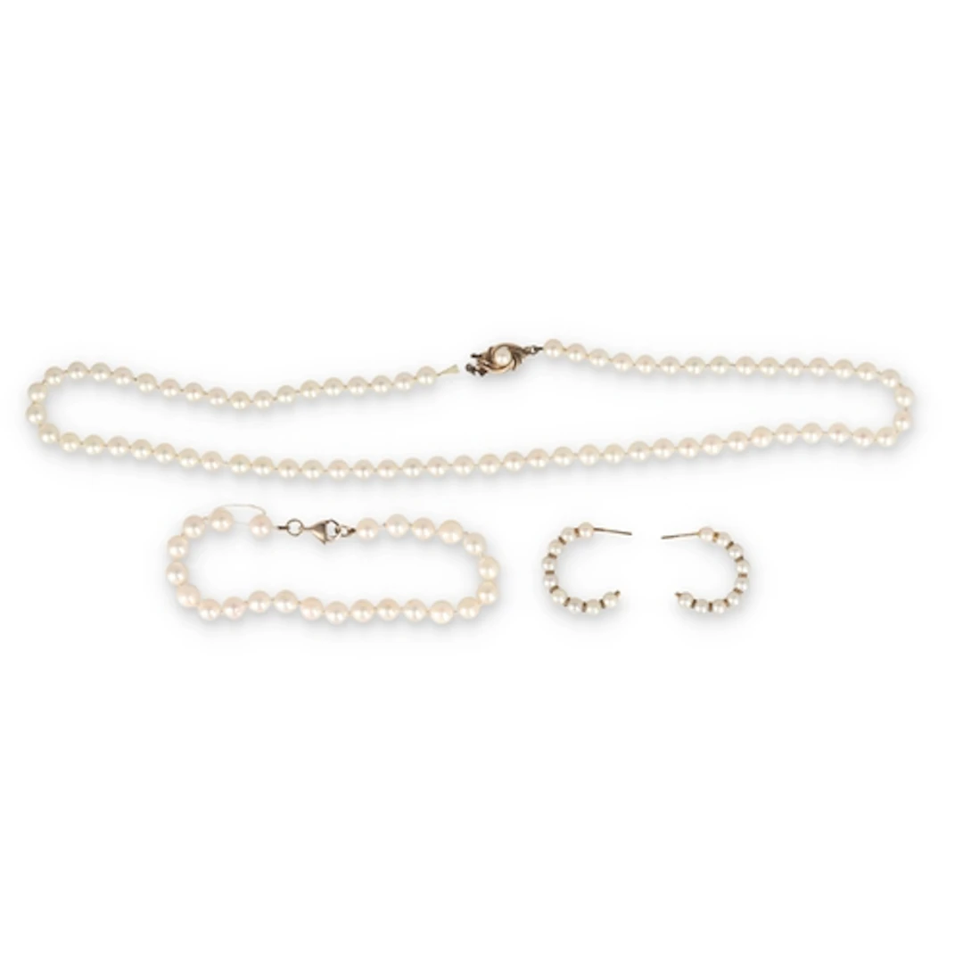 A MIKIMOTO CULTURED PEARL GOLD SUITE Comprising a bracelet, ...