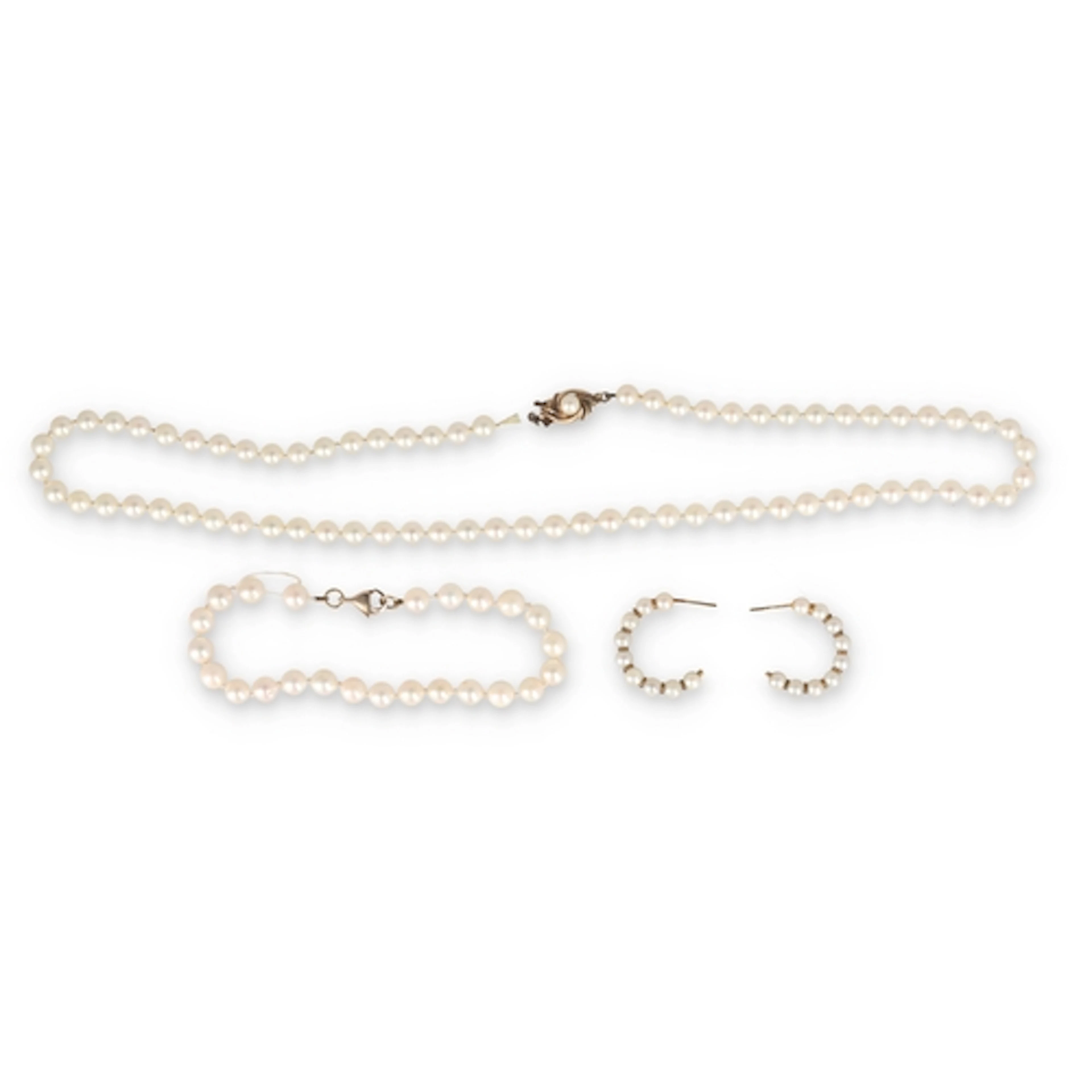 A MIKIMOTO CULTURED PEARL GOLD SUITE Comprising a bracelet, ...