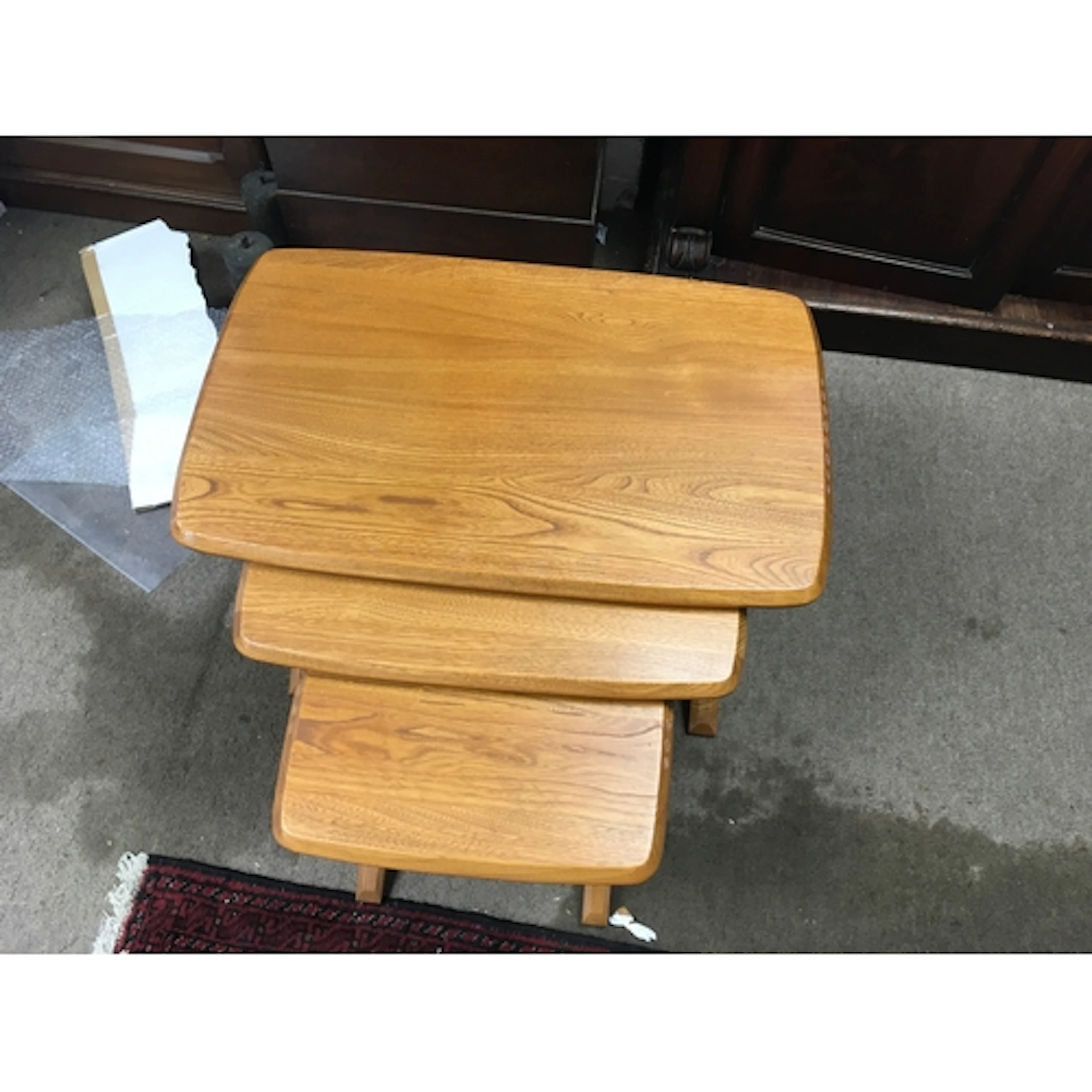 A nest of very light coloured elm Ercol tables. Mid 20th cen...