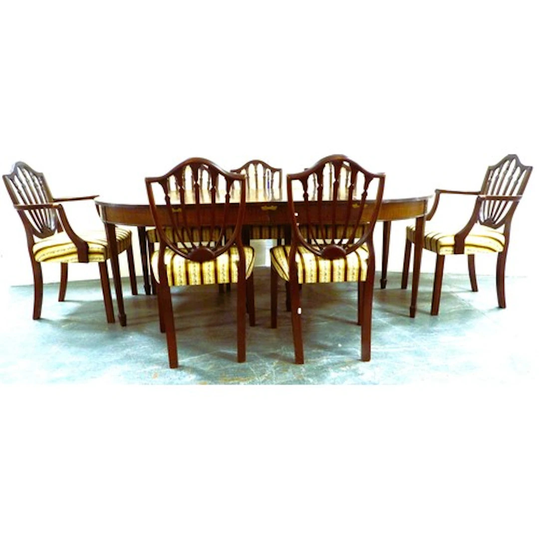 Seven matching Hepplewhite style mahogany dining chairs to i...