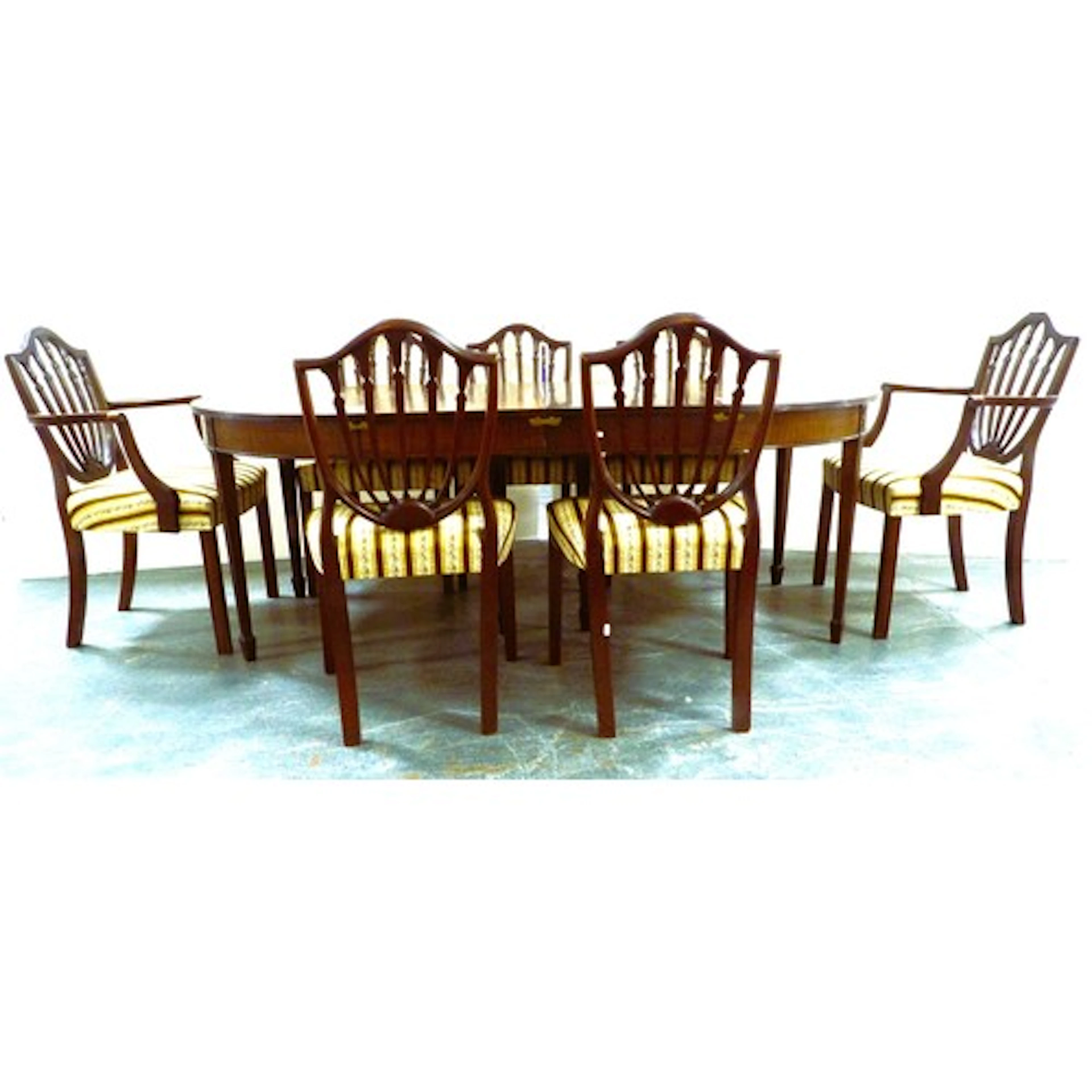 Seven matching Hepplewhite style mahogany dining chairs to i...