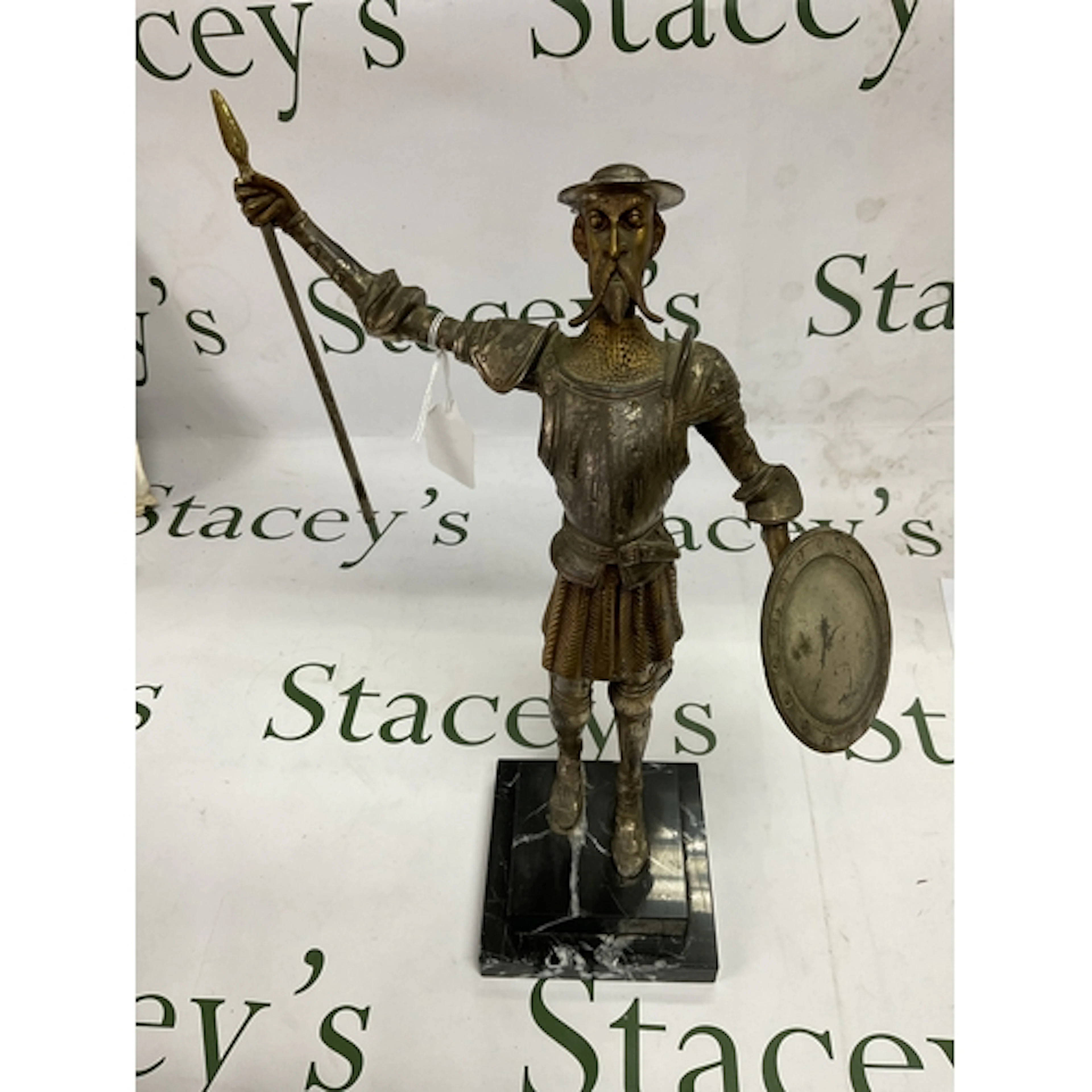 Bronze figure of Don Quixote, on a stepped black marbled bas...