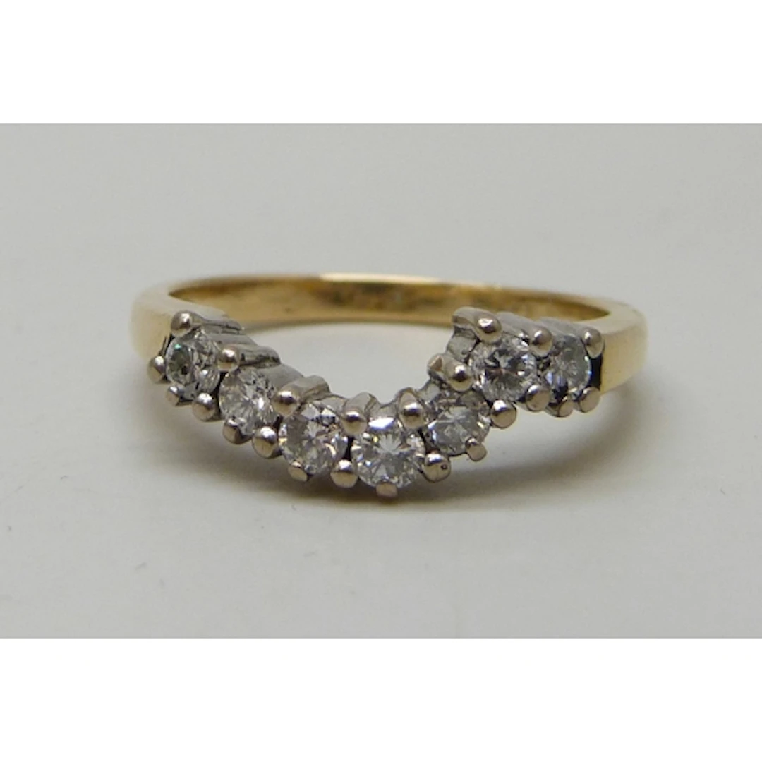 An 18ct gold seven stone diamond ring, 4.8g, N/O