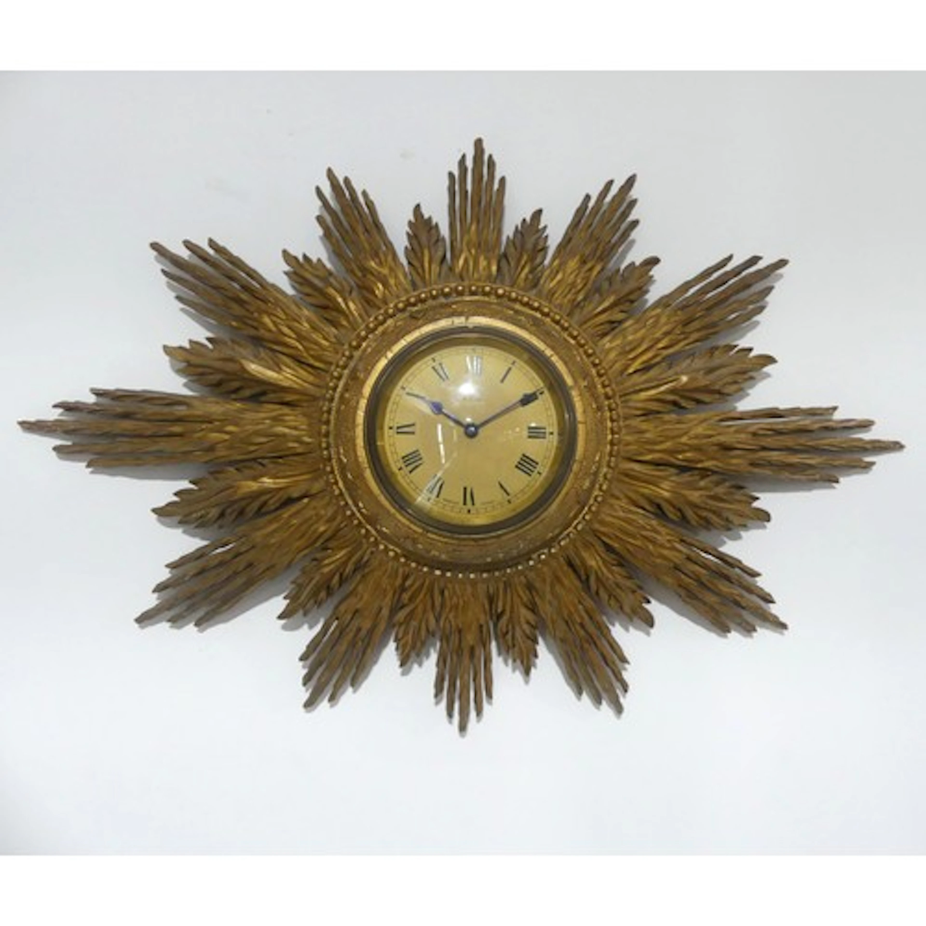 A vintage giltwood framed sunburst wall clock, with French 8...