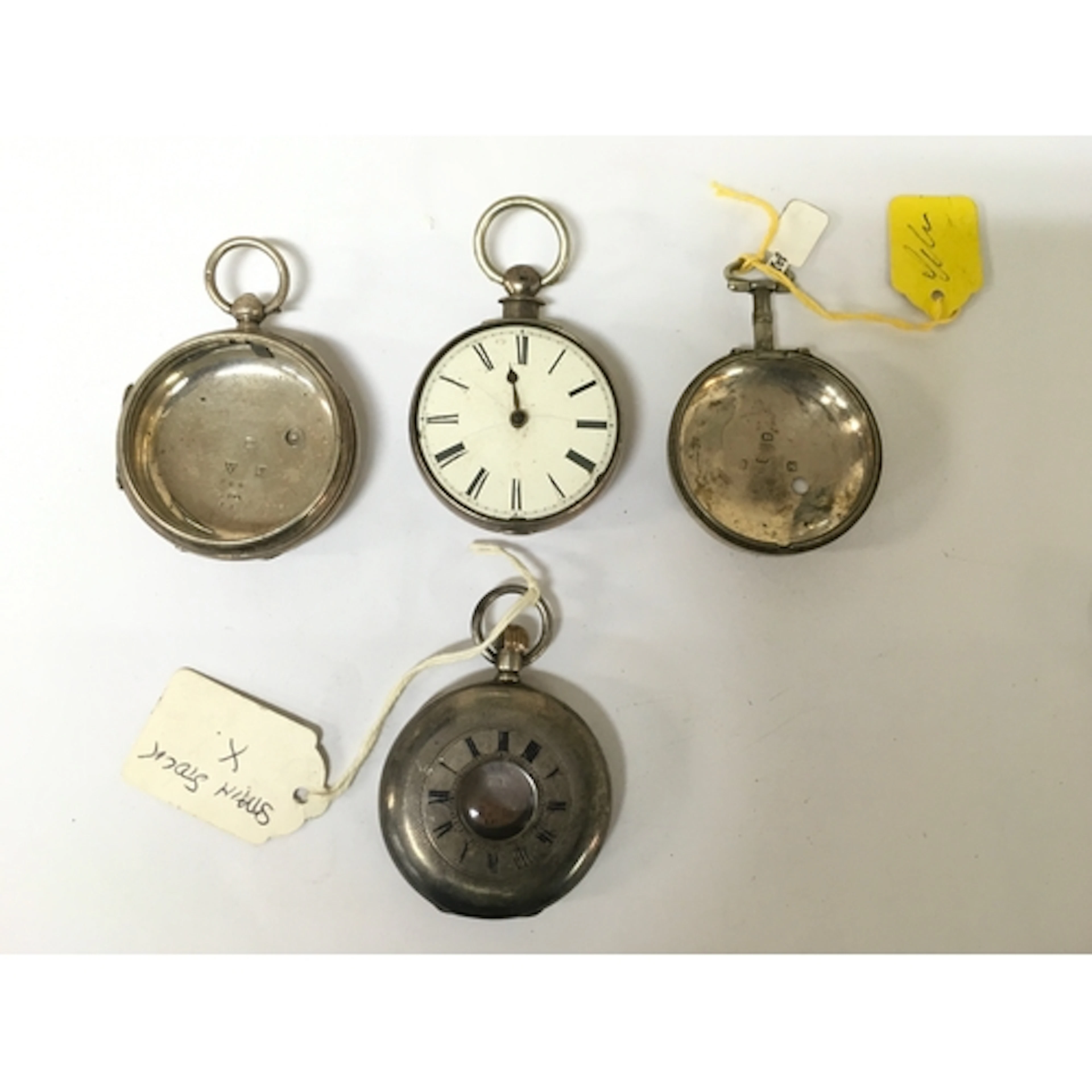 Three 19th century silver watch cases plus one back, all hal...