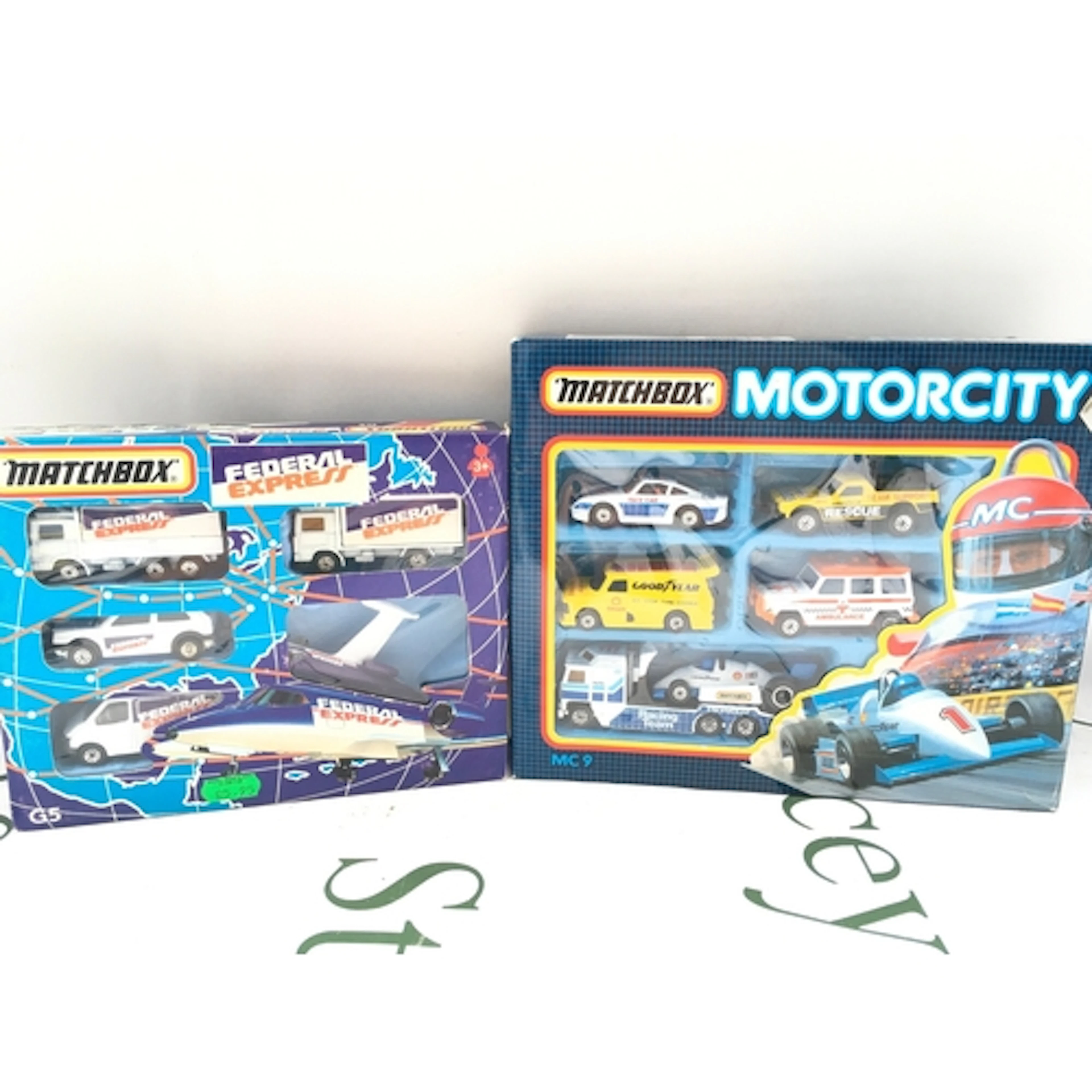 A Boxed Matchbox Motorcity Set MC9 And A Federal Express Set...
