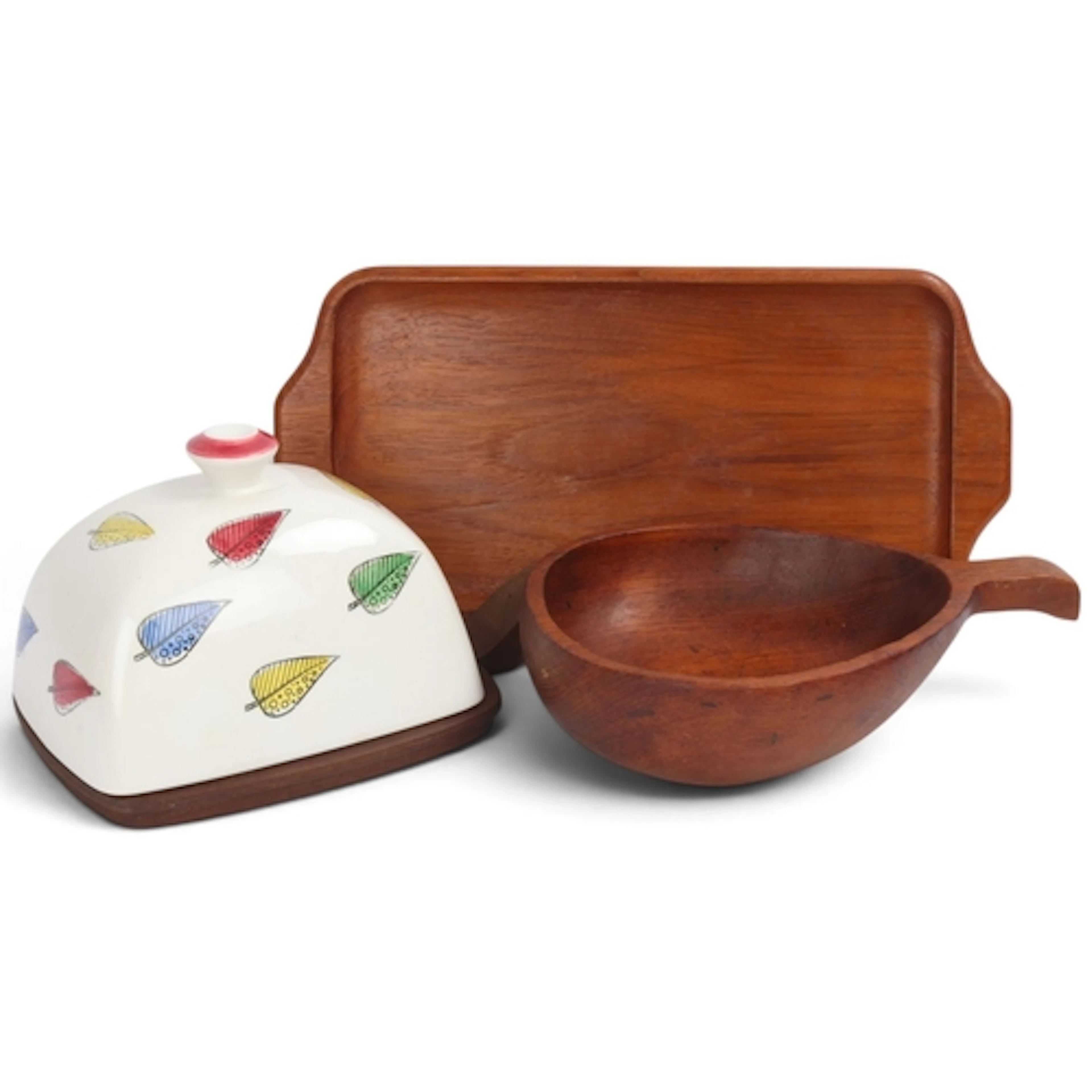 Three teak mid-century serving dishes, including a tray by K...
