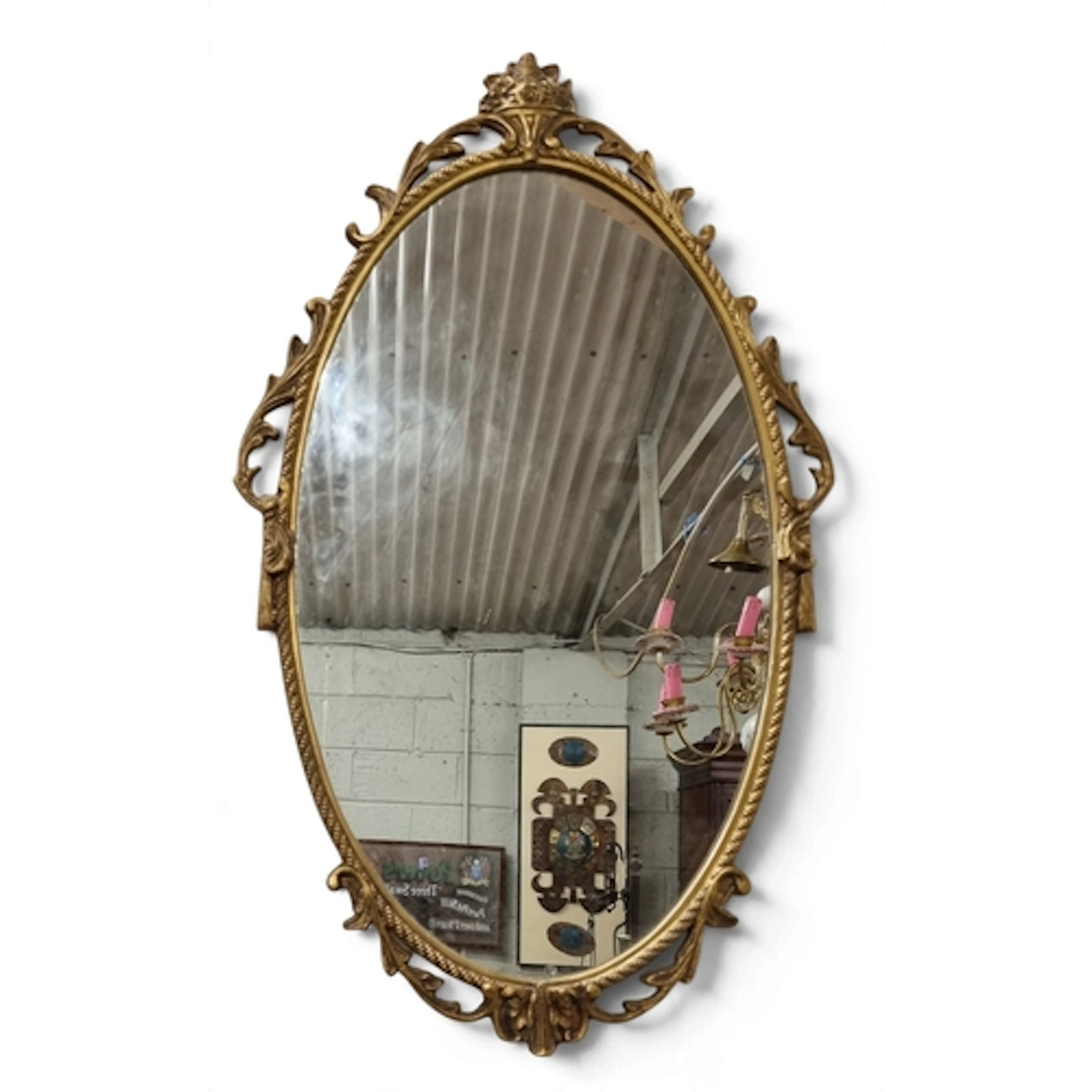A 20th Century Metal oval Mirror with pierced outline. 67 x ...