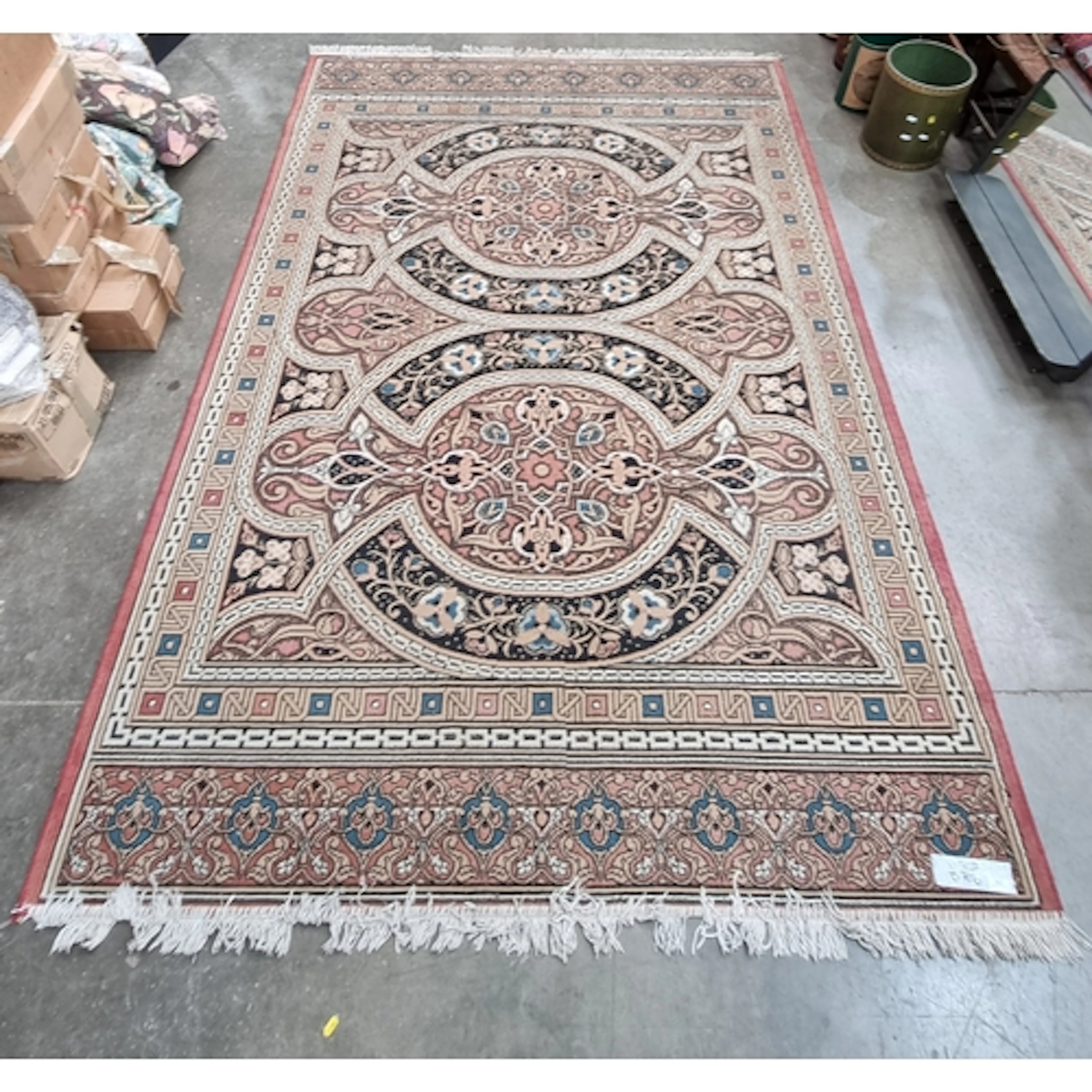 A Tabriz style machine made Rug with multiple borders and fl...