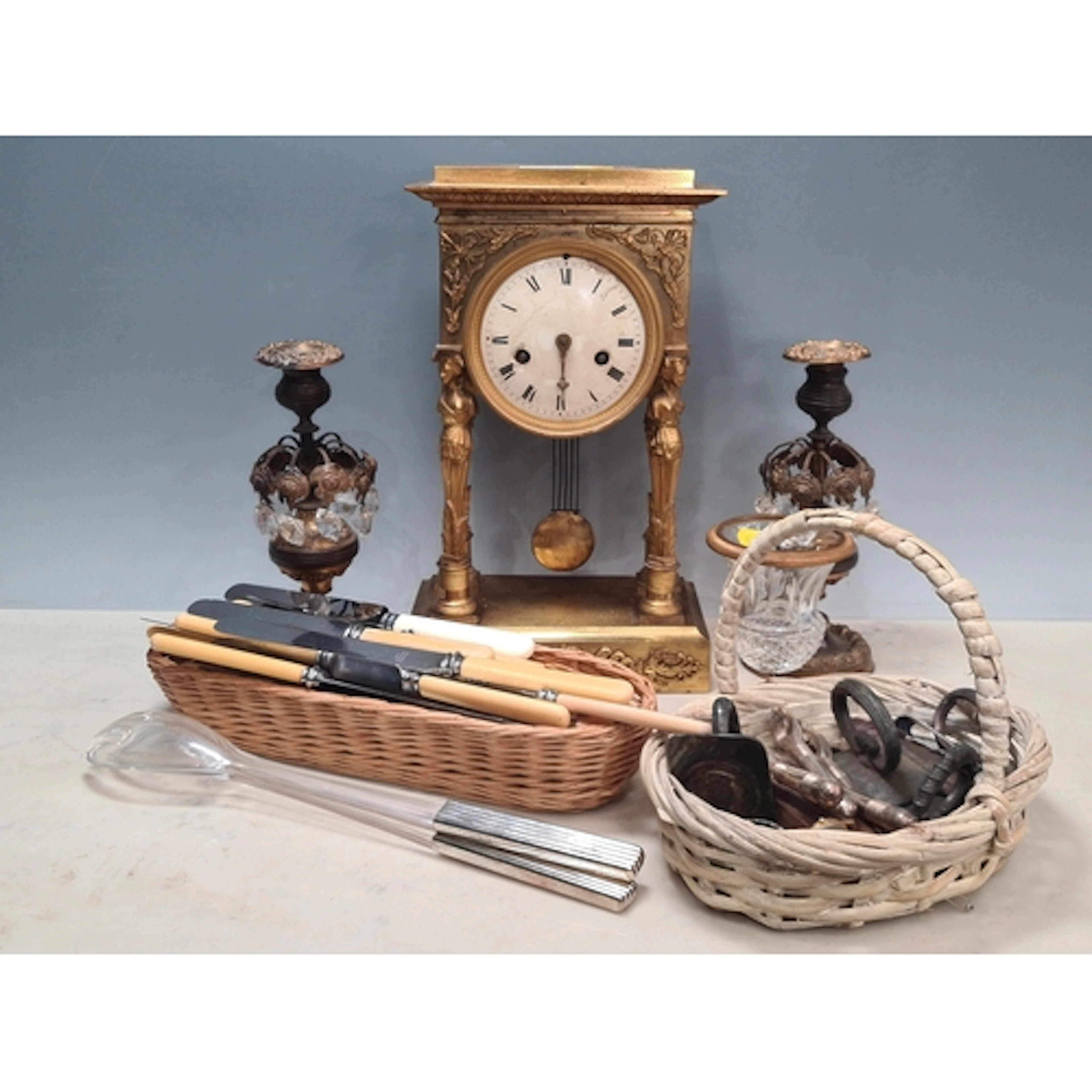 A gilt metal Portico style Mantel Clock with circular dial a...