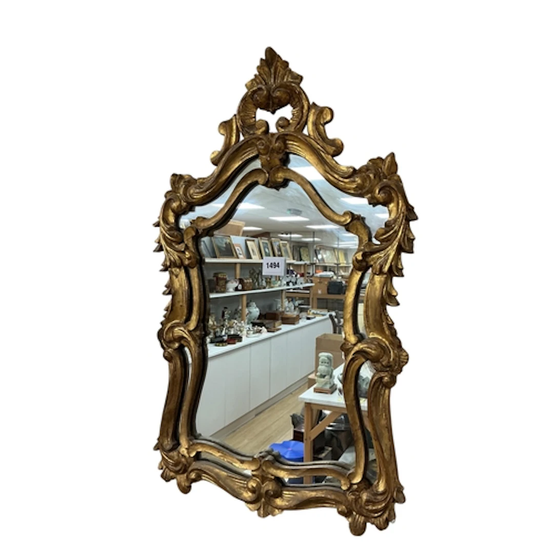 A reproduction Florentine style giltwood cartouche wall mirr...