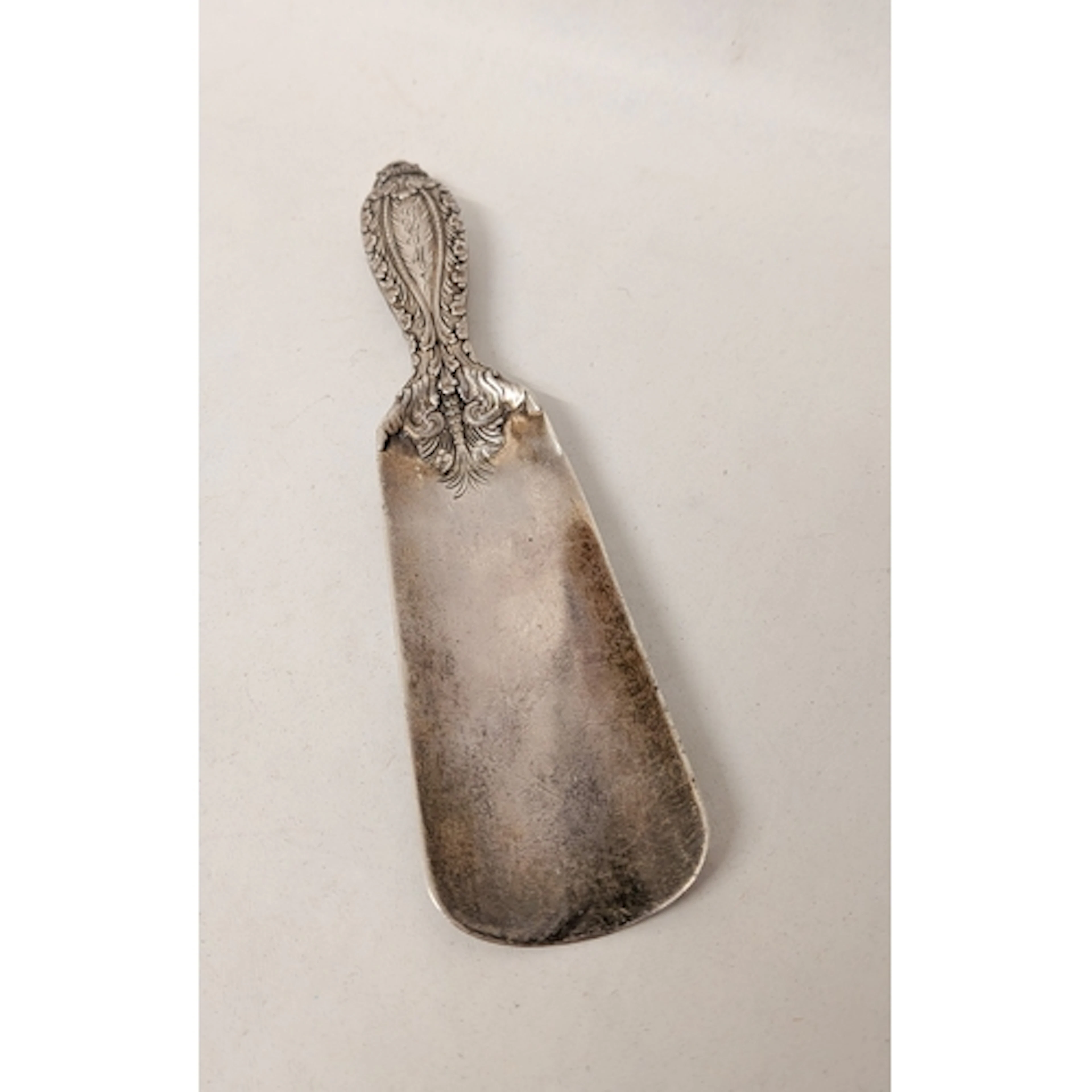 Tiffany & Co - a vintage silver shoe horn, with decorative e...