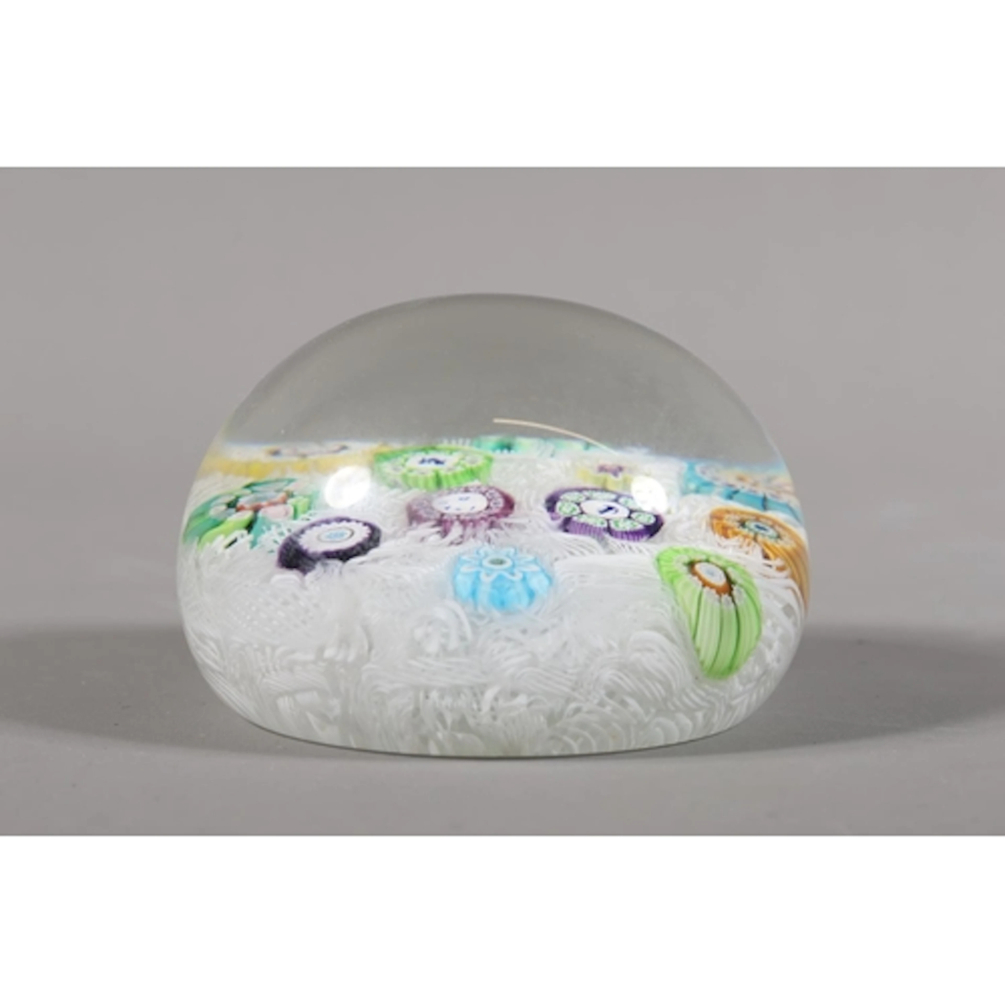 Perthshire paperweight with millefiori decoration along with...