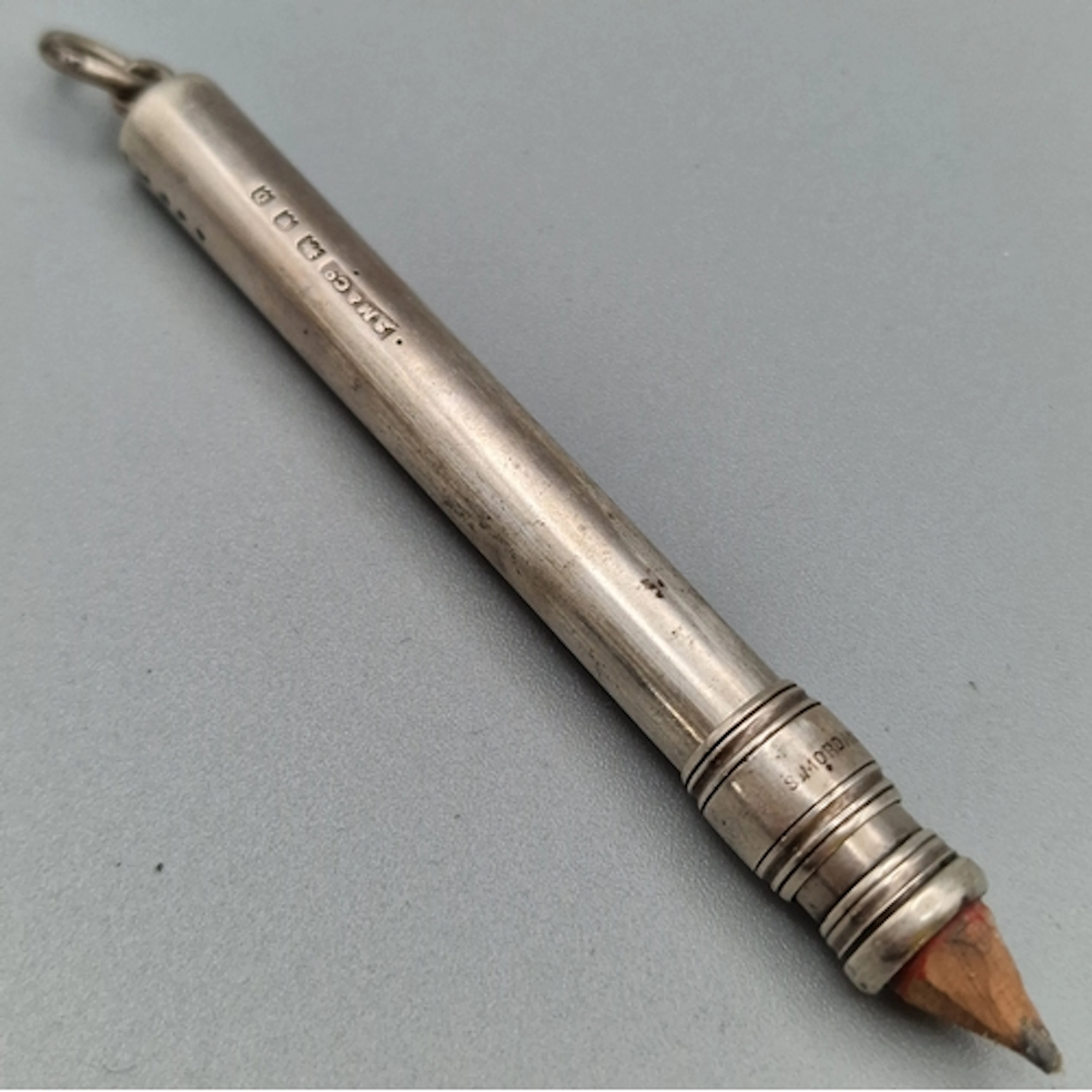 Sampson Mordan Co, a silver propelling pencil of plain cylin...