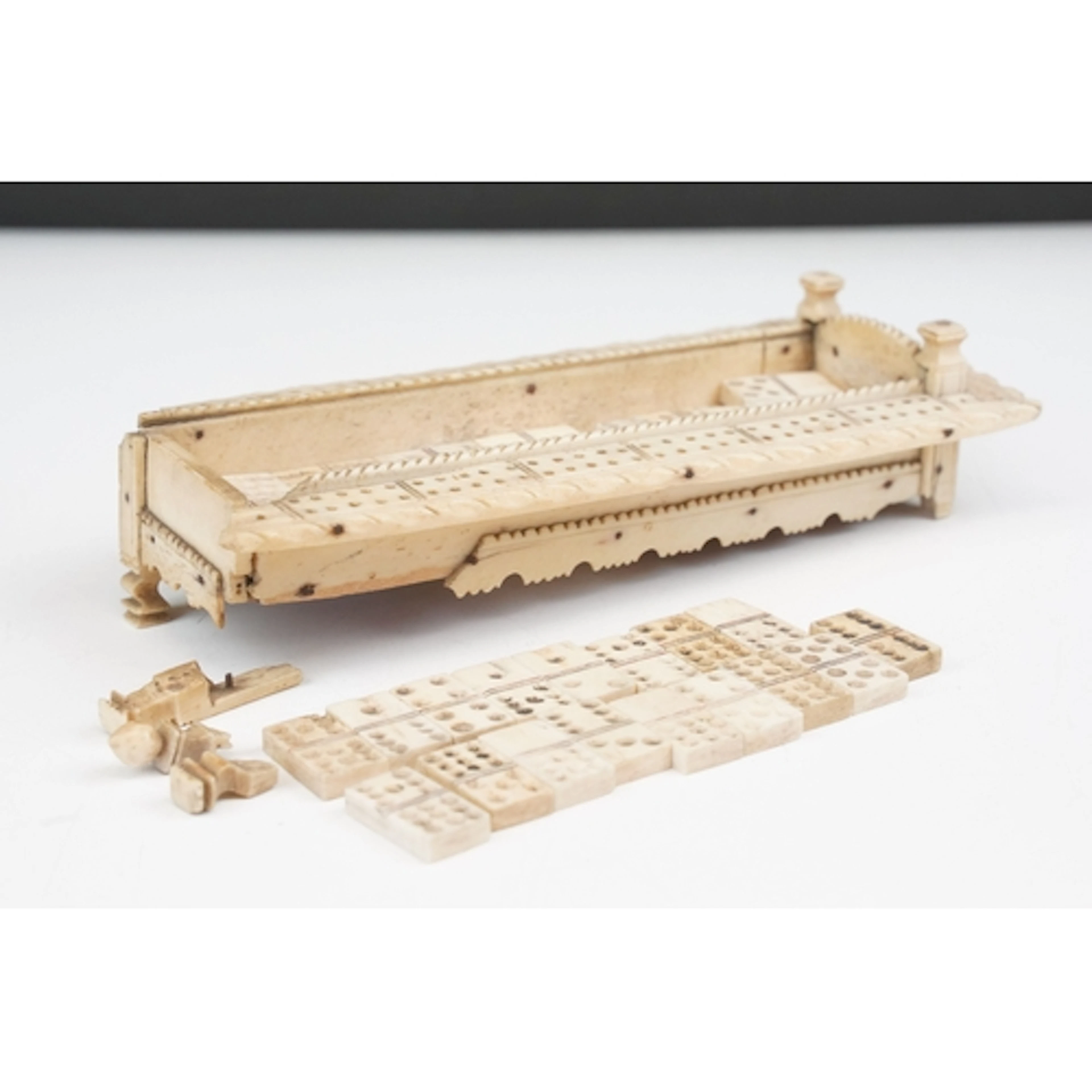 Napoleonic prisoner of war carved bone cribbage board and se...
