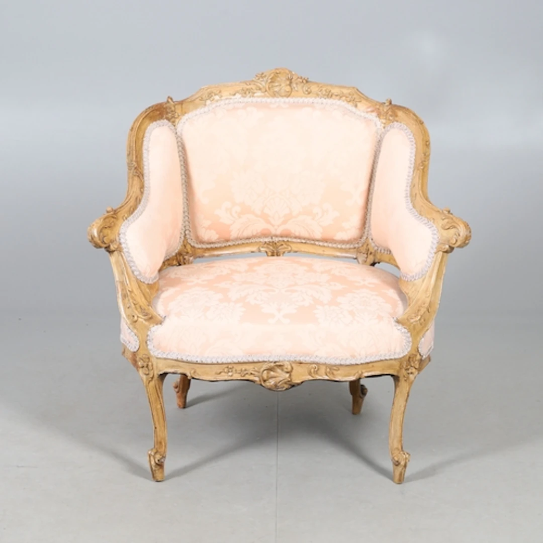 A FRENCH BEECH SALON TUB CHAIR. early 20th century, the foli...