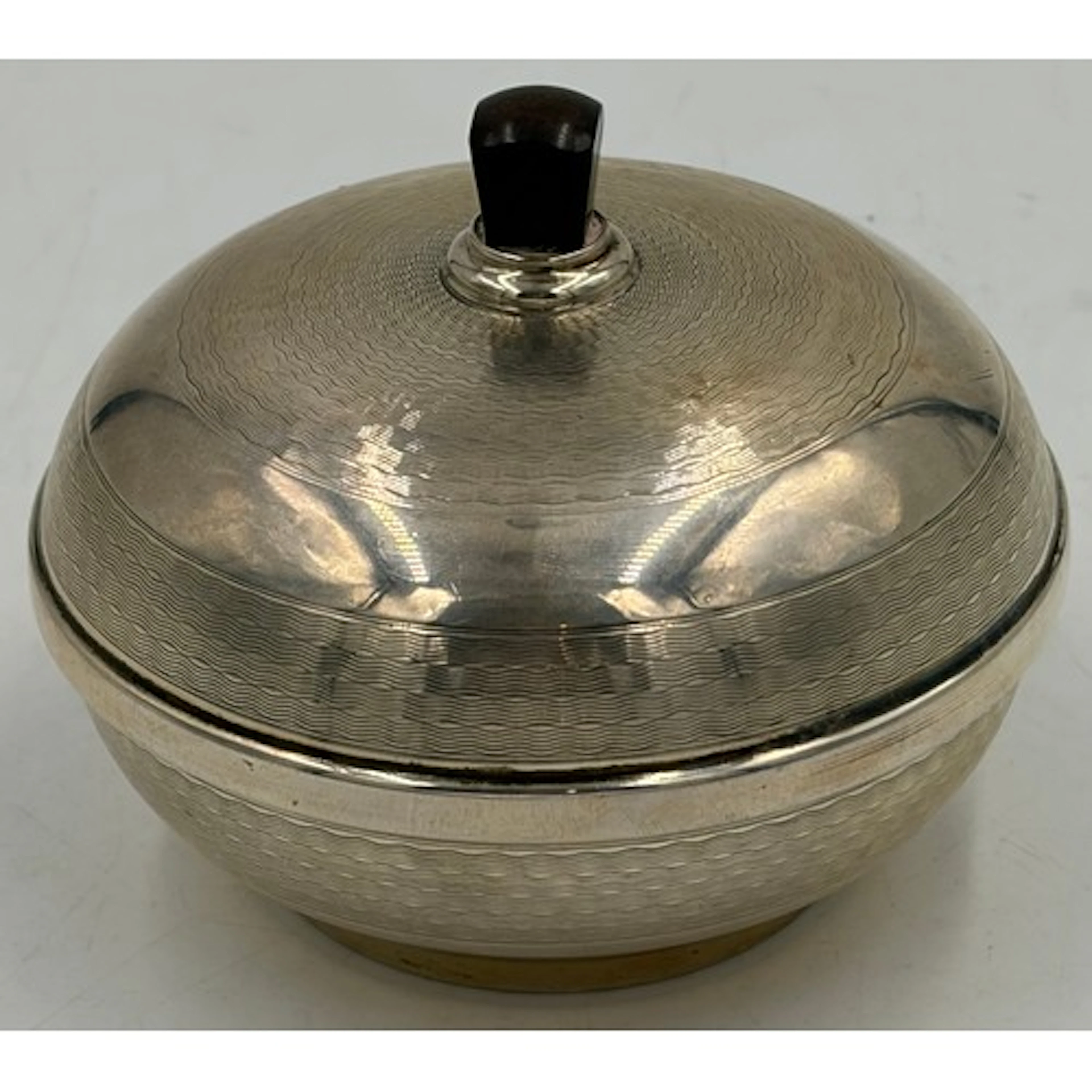 A silver machine turned powder bowl with bakelite lining 10c...