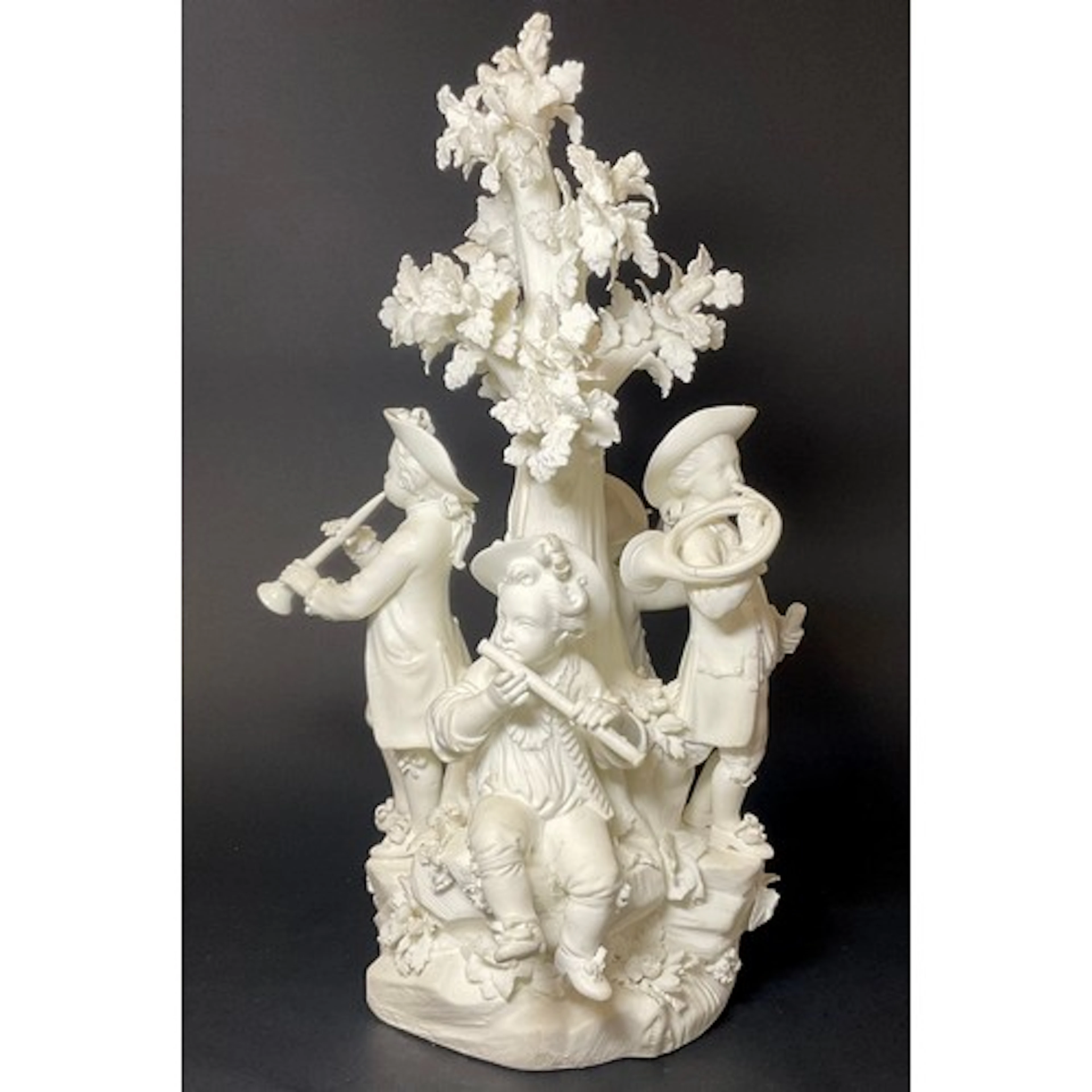 A Derby bisque figure group, Four Boys Playing Music, each w...