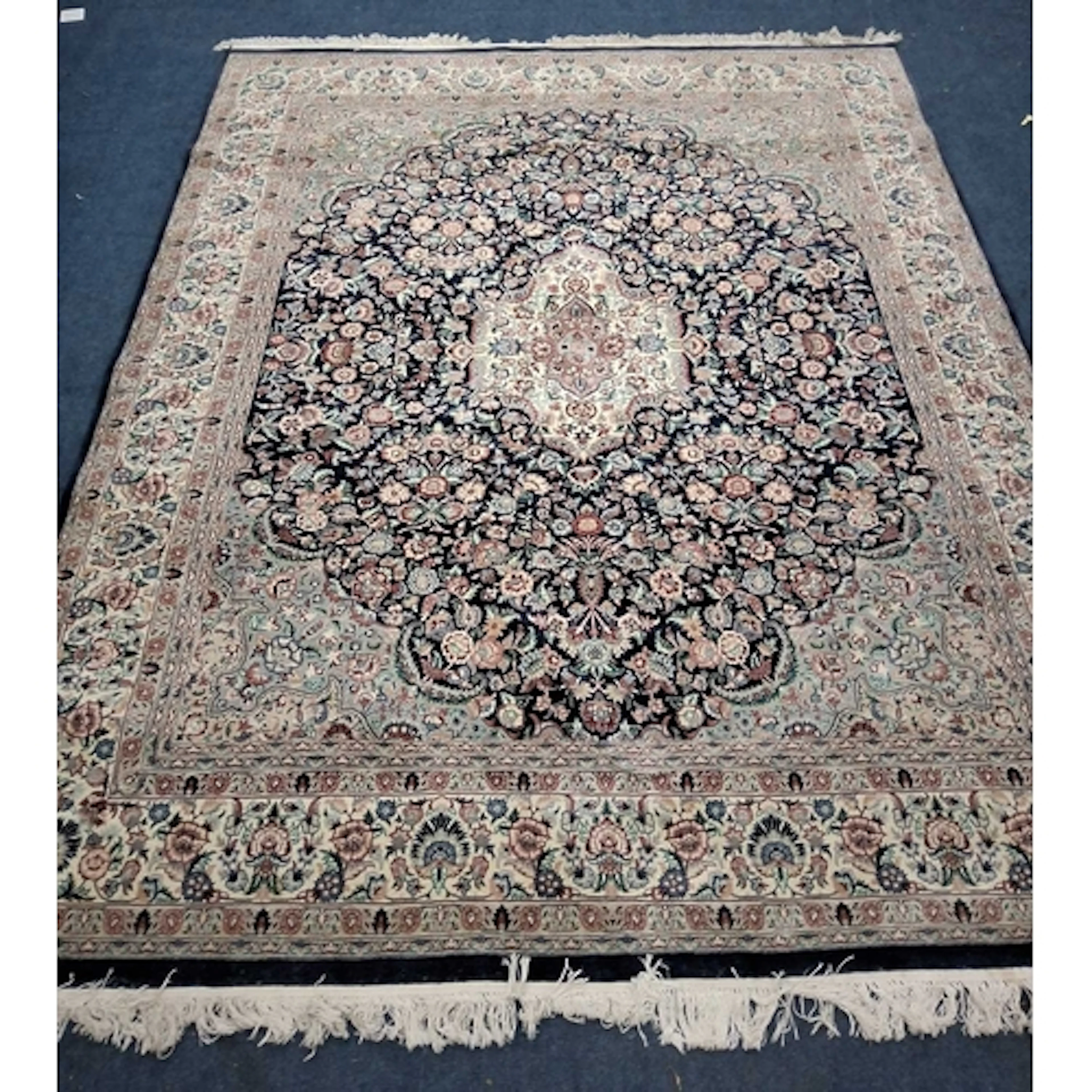 A LARGE RECTANGULAR WOOLLEN RUG, depicting a selection of sc...