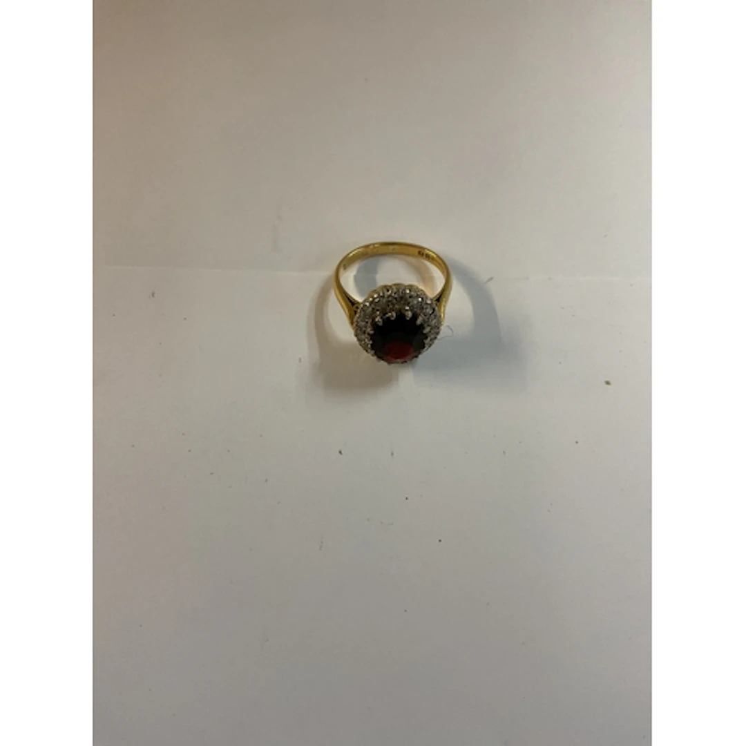 An 18 ct Diamond & Garnet ring, with 15 (26 cuts) ...