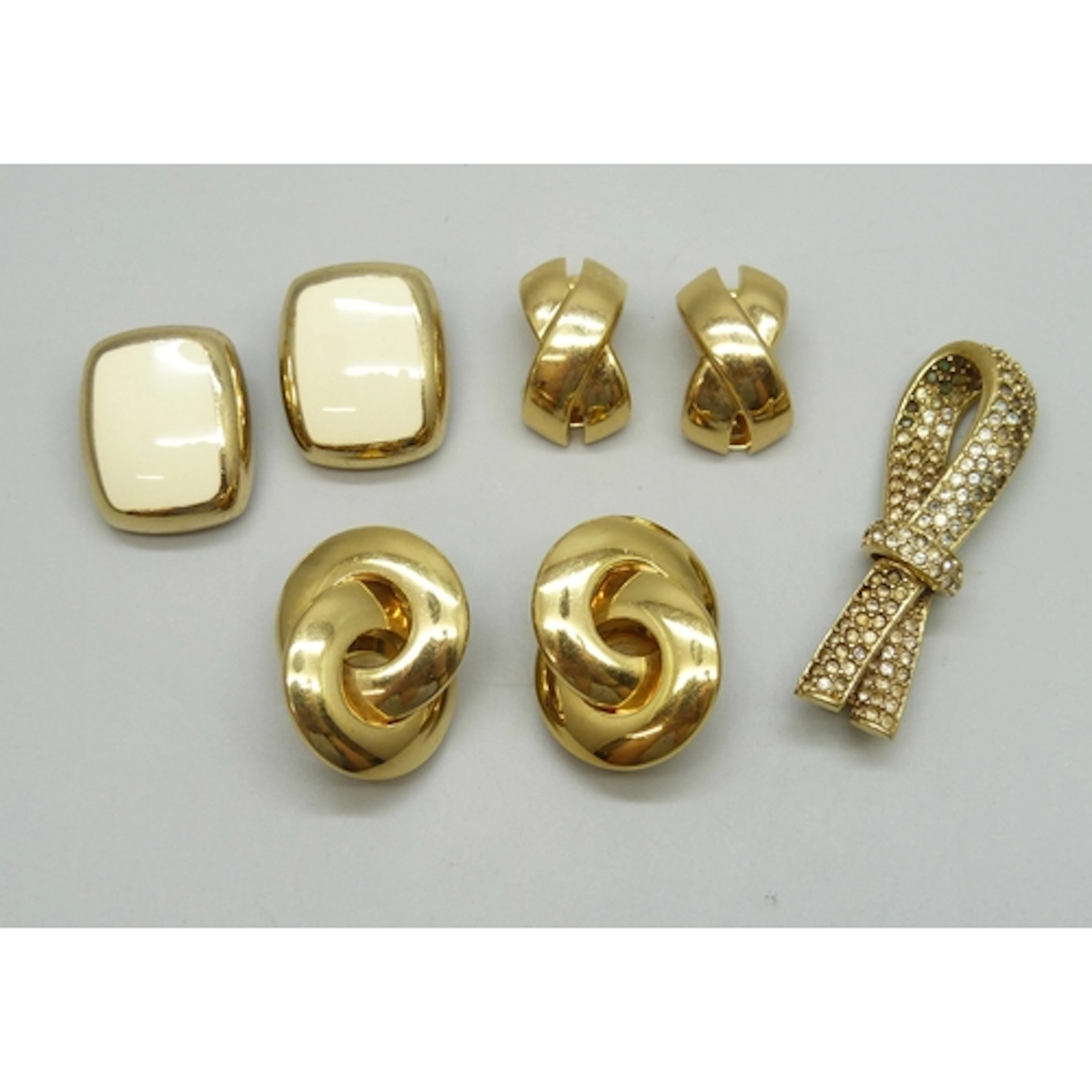 Three pairs of vintage Christian Dior clip on gold tone earr...
