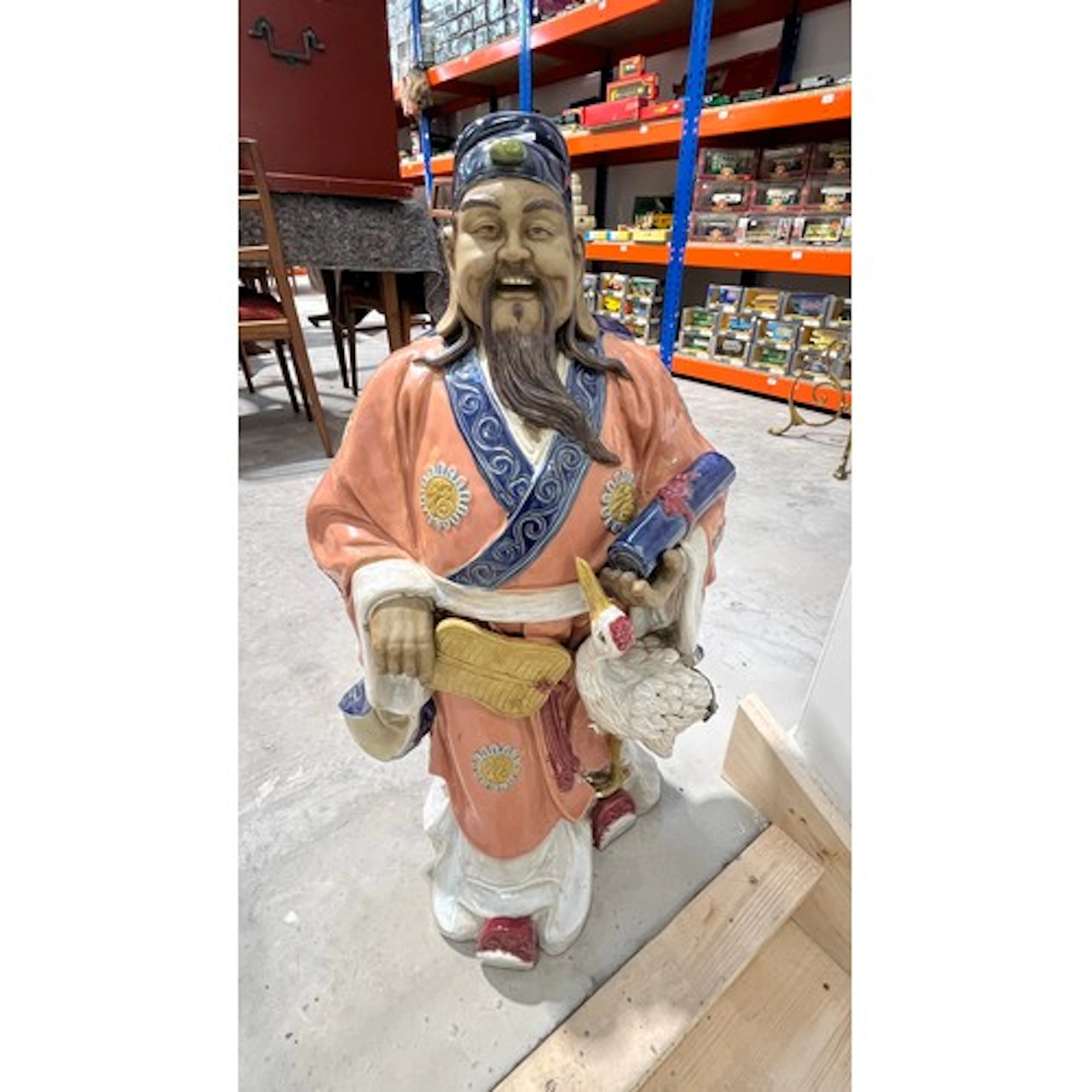 Oriental ceramic figure of a gent holding a scroll with a cr...