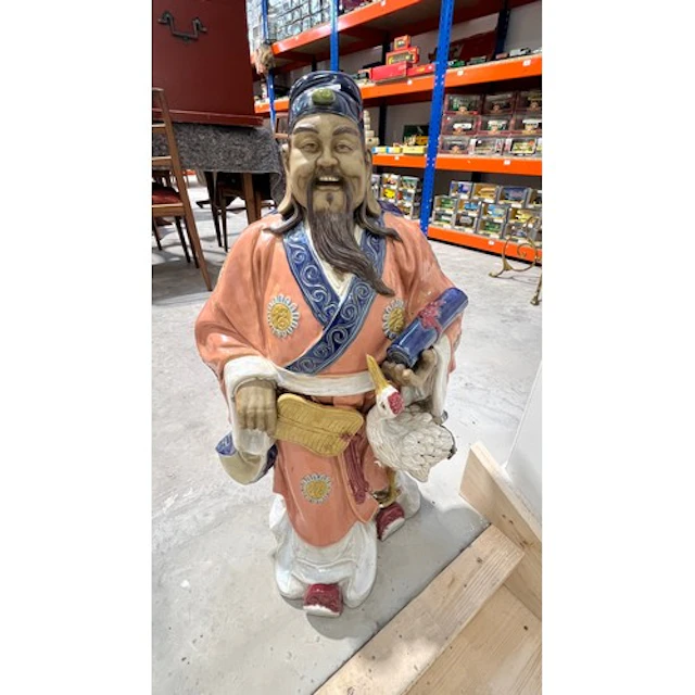 Oriental ceramic figure of a gent holding a scroll with a cr...
