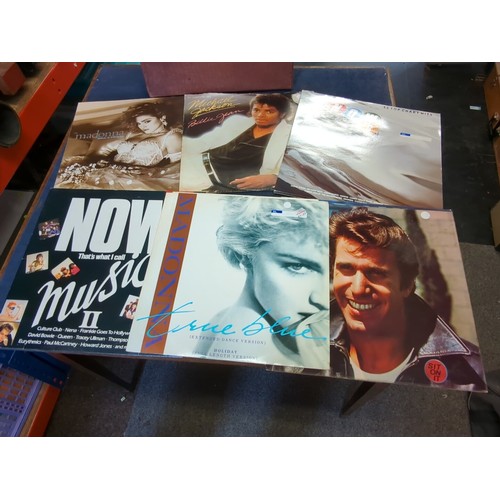 A collection of pop music vinyl records, including Michael J...