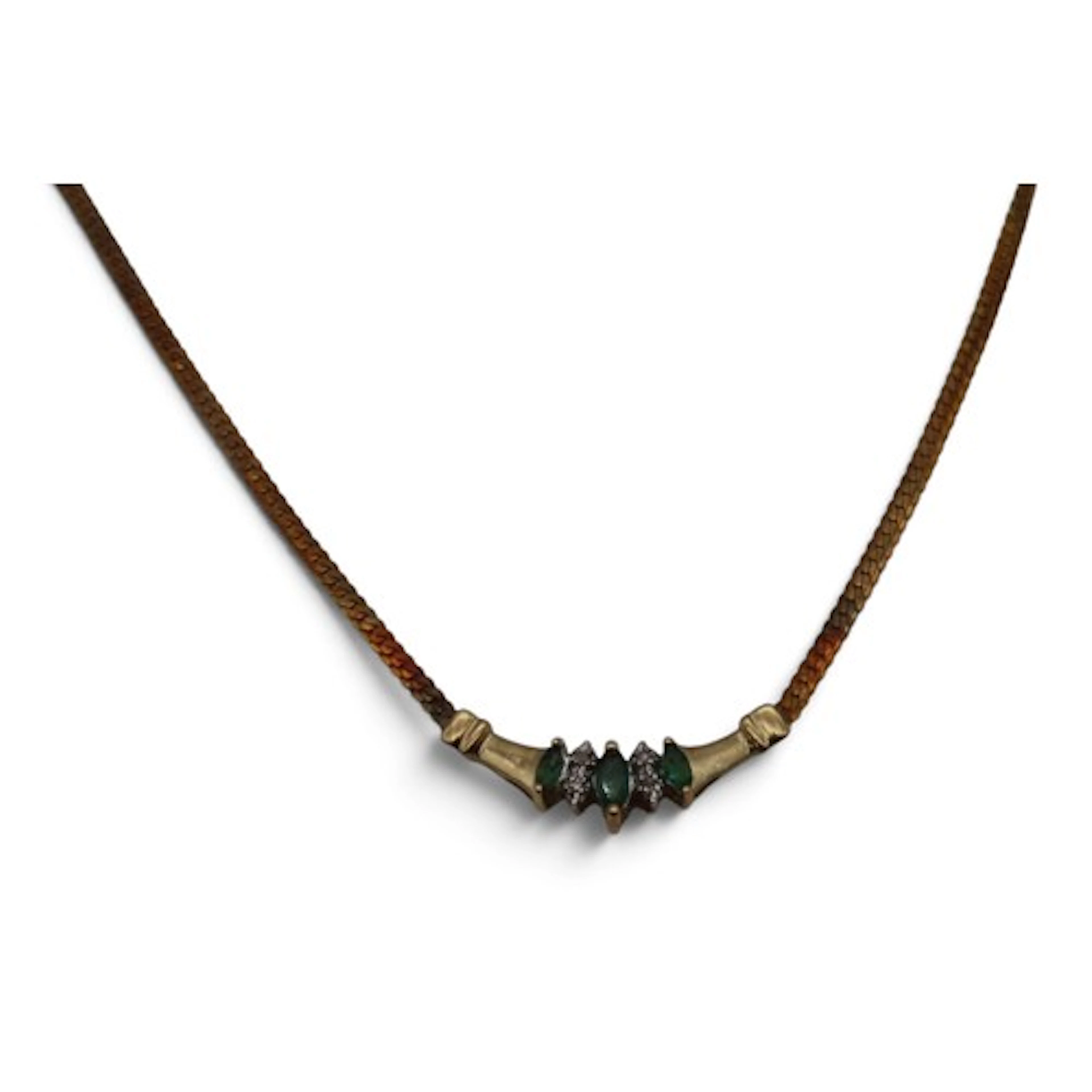An emerald and diamond pendant necklace, set with three marq...
