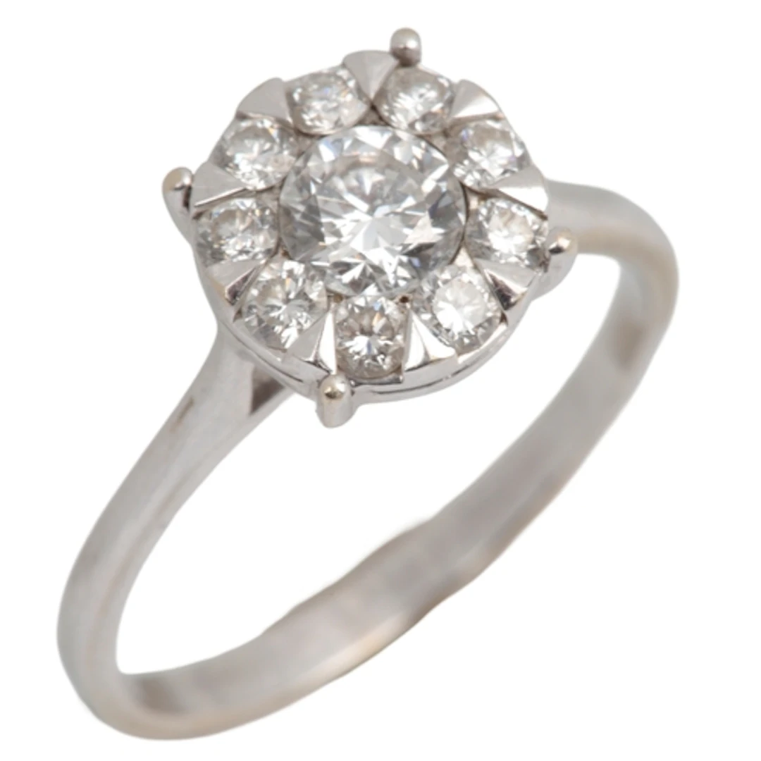 A diamond cluster ring, centring on a brilliant-cut diamond ...
