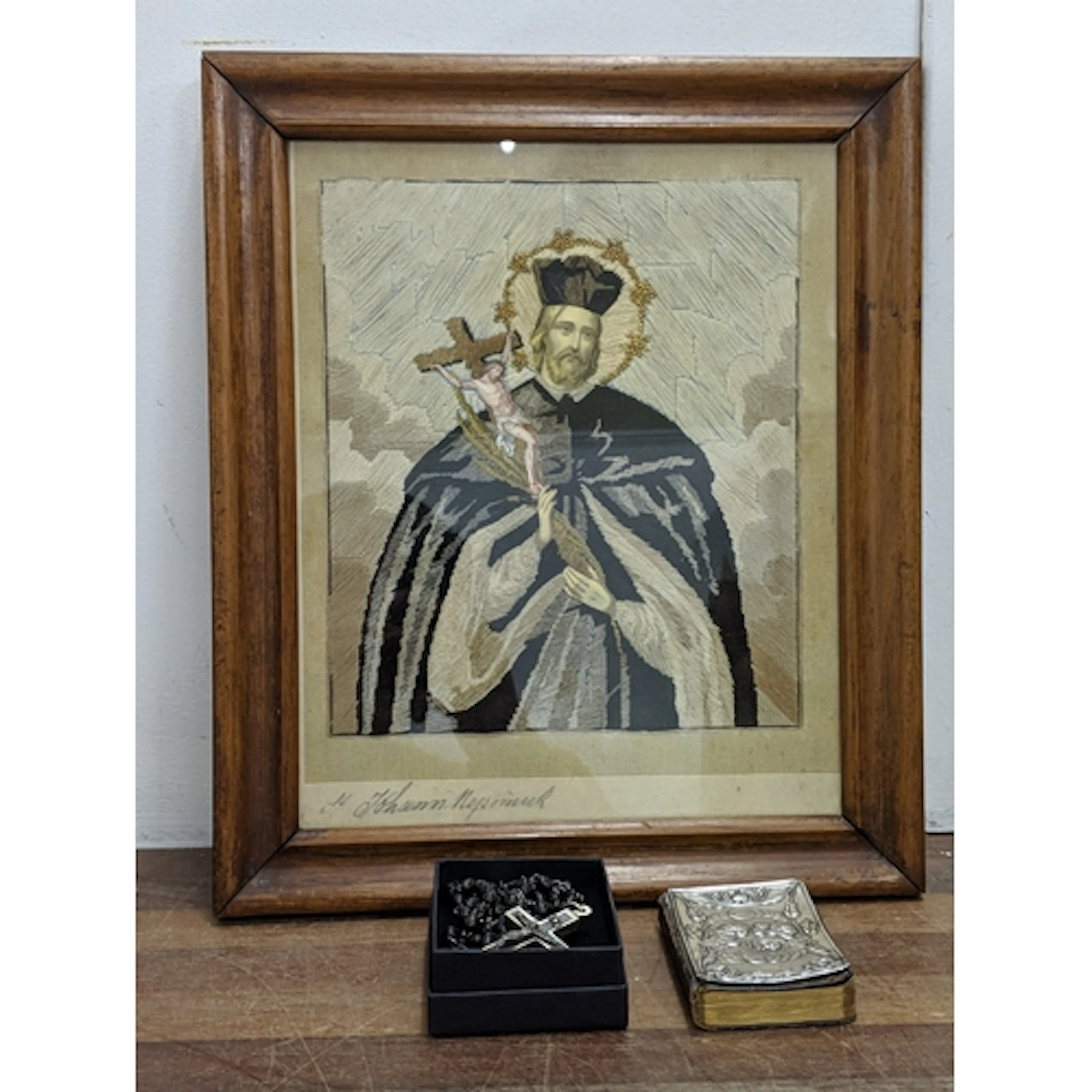 A vintage sample/embroidery depicting Saint John of Nepomuk,...