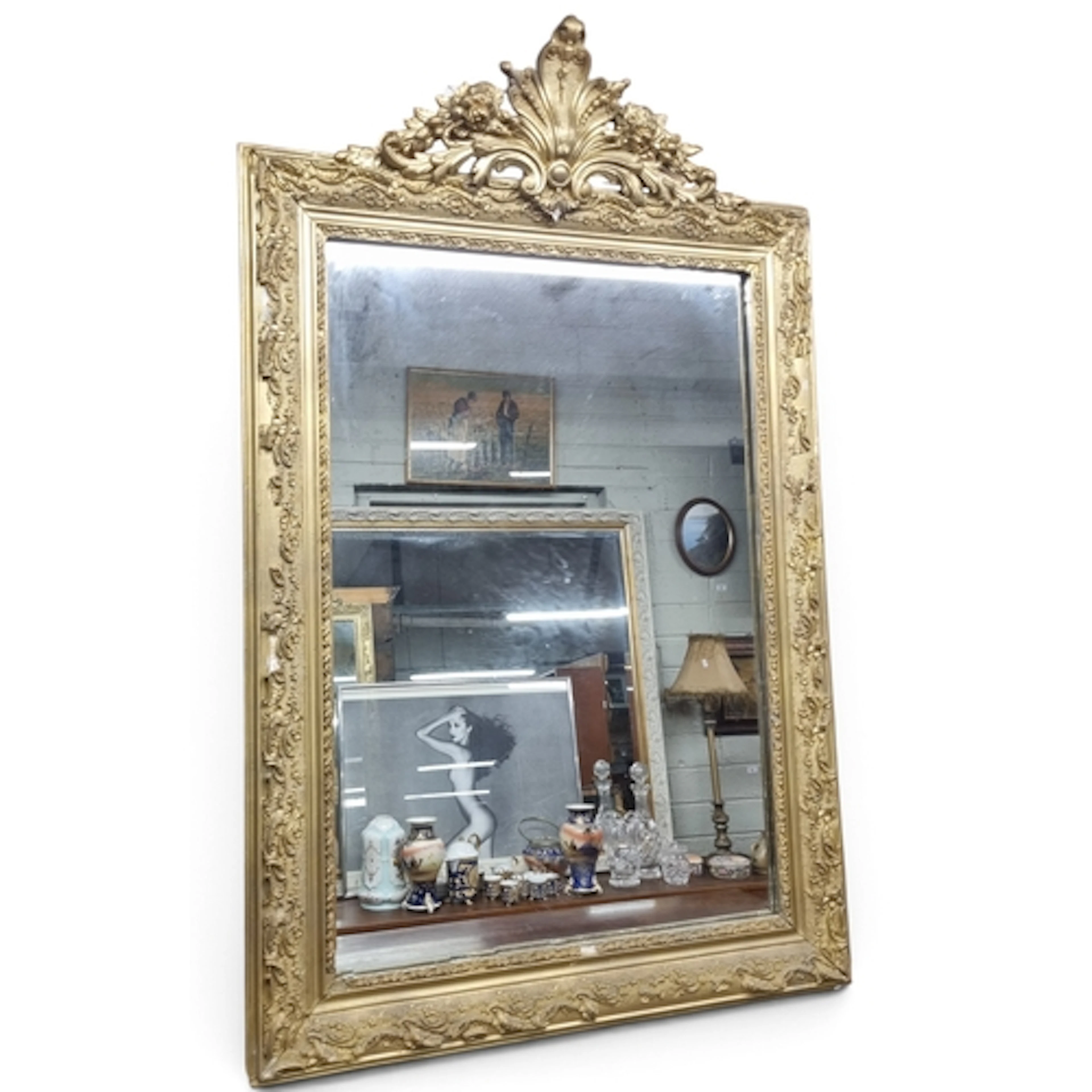 A late 19th Century Timber and Plaster Gilt Overmantle Mirro...
