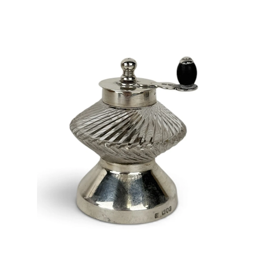A LATE VICTORIAN SILVER MOUNTED CUT GLASS PEPPER GRINDER, LO...