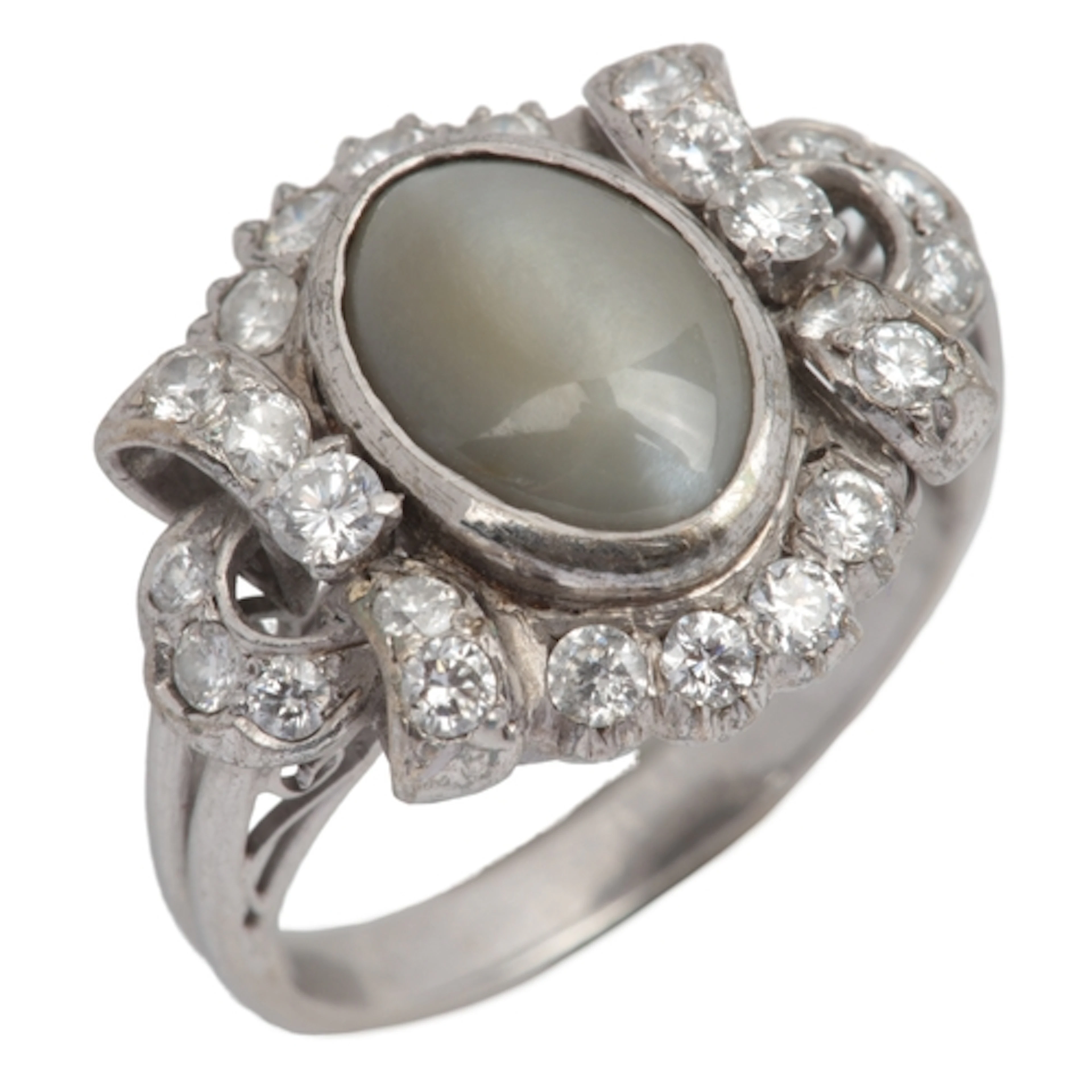 A chrysoberyl cat's eye and diamond ring, mid 20th century, ...