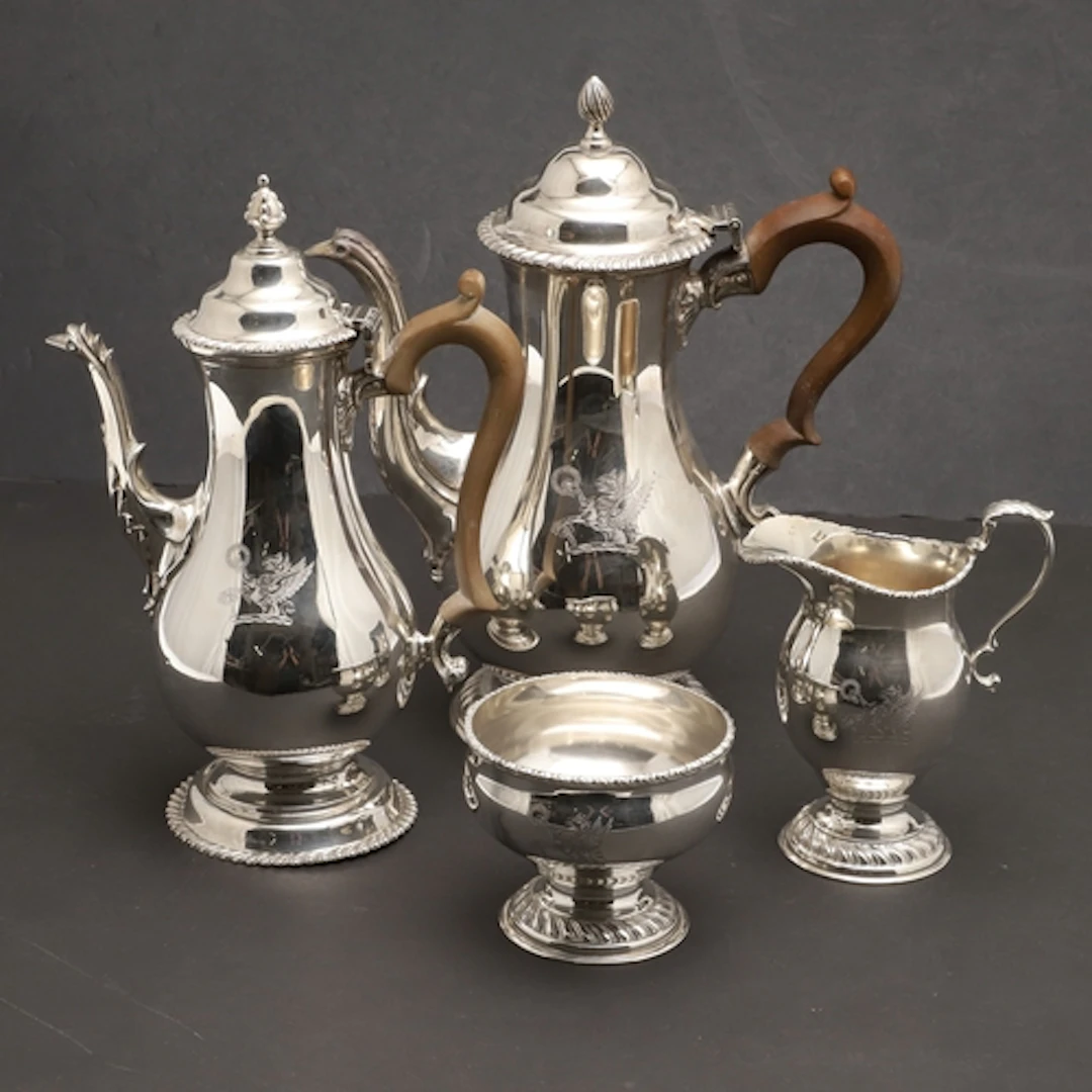 AN ELIZABETH II FOUR PIECE SILVER MATCHED COFFEE SET. To inc...