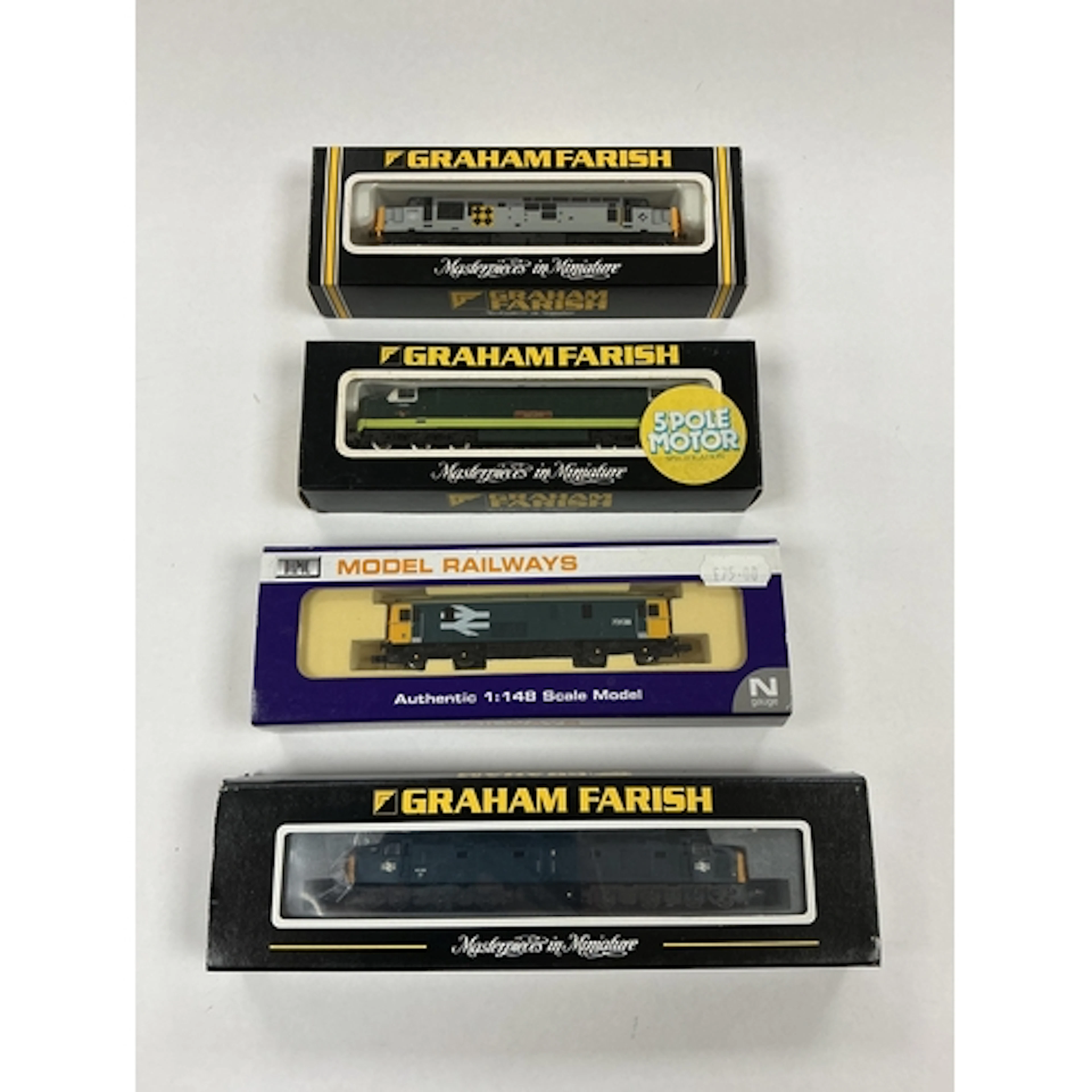 Four boxed Graham Farish and Dapol N gauge railway diesel lo...
