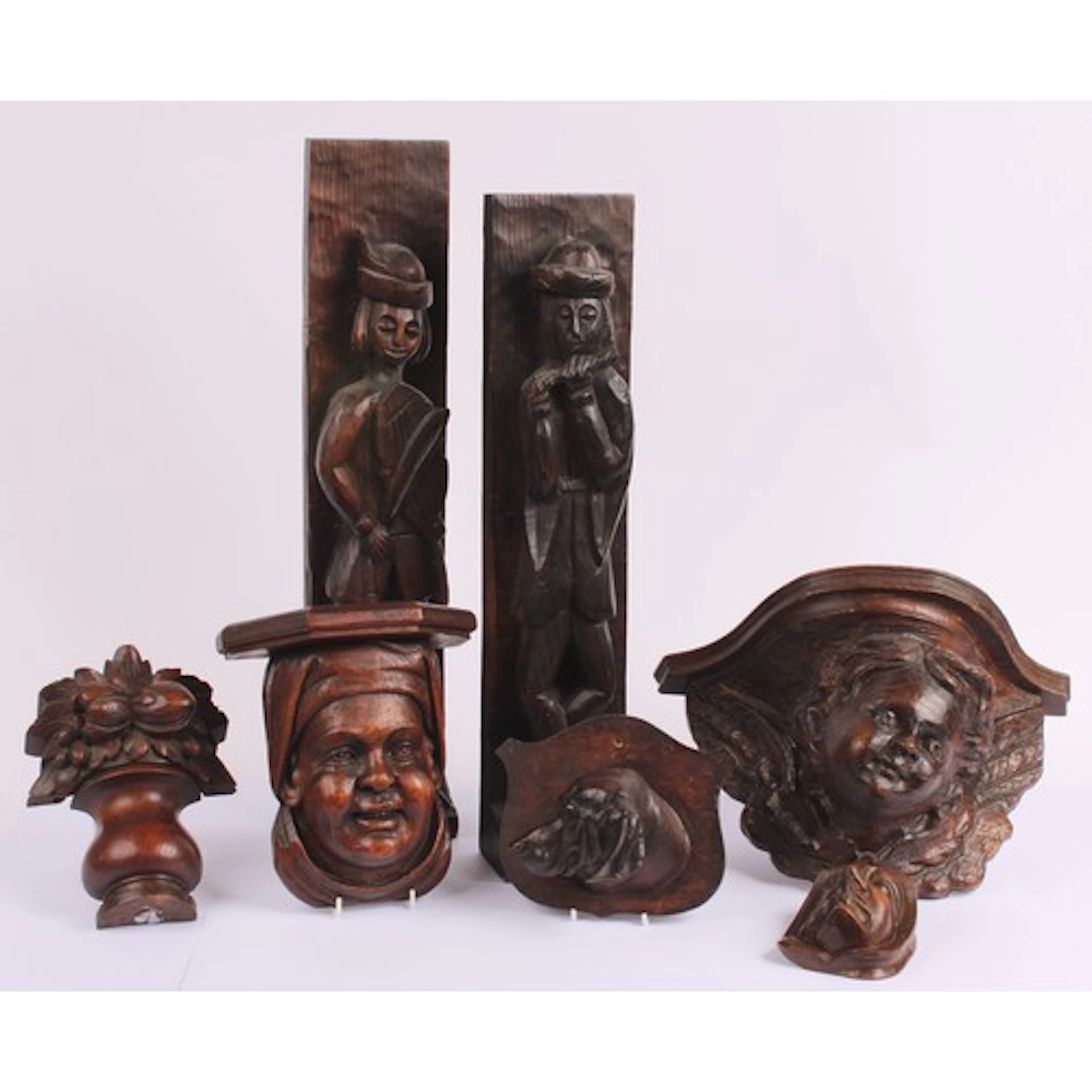 An Arts & Crafts oak corbel, carved in the Baroque taste wit...