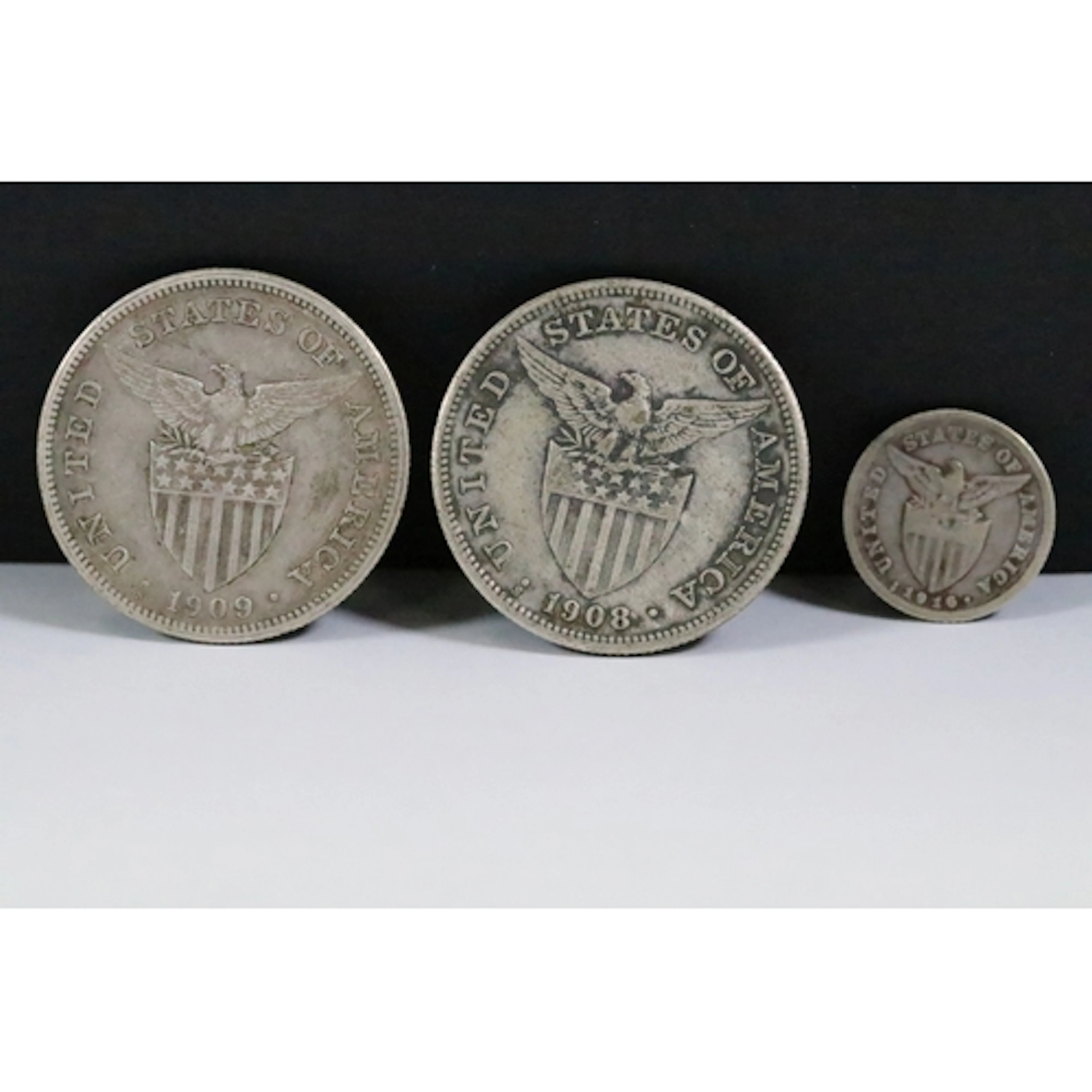 Two Philippines Insular Government period silver One Peso co...