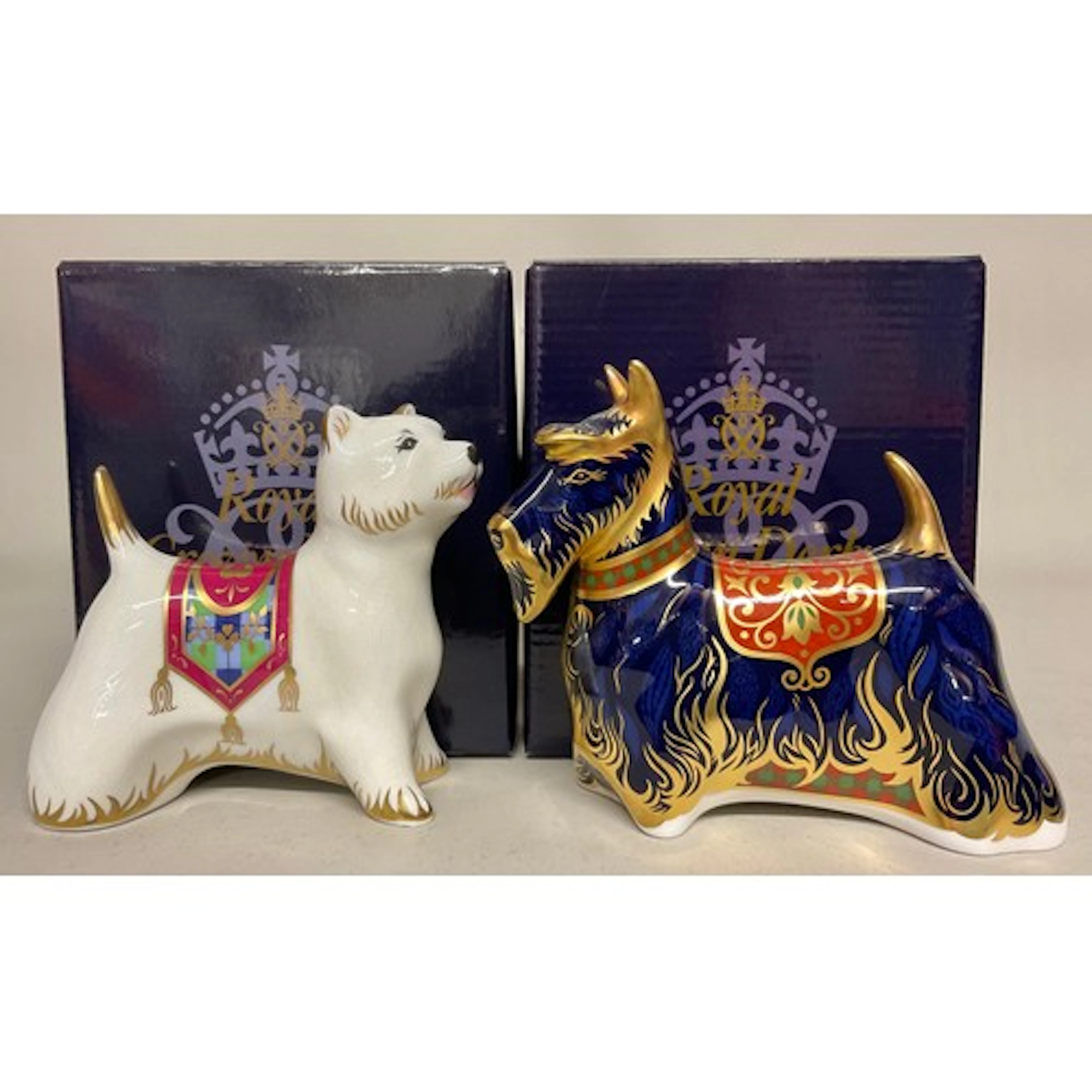 A Royal Crown Derby paperweight, Scottish Terrier, gold stop...