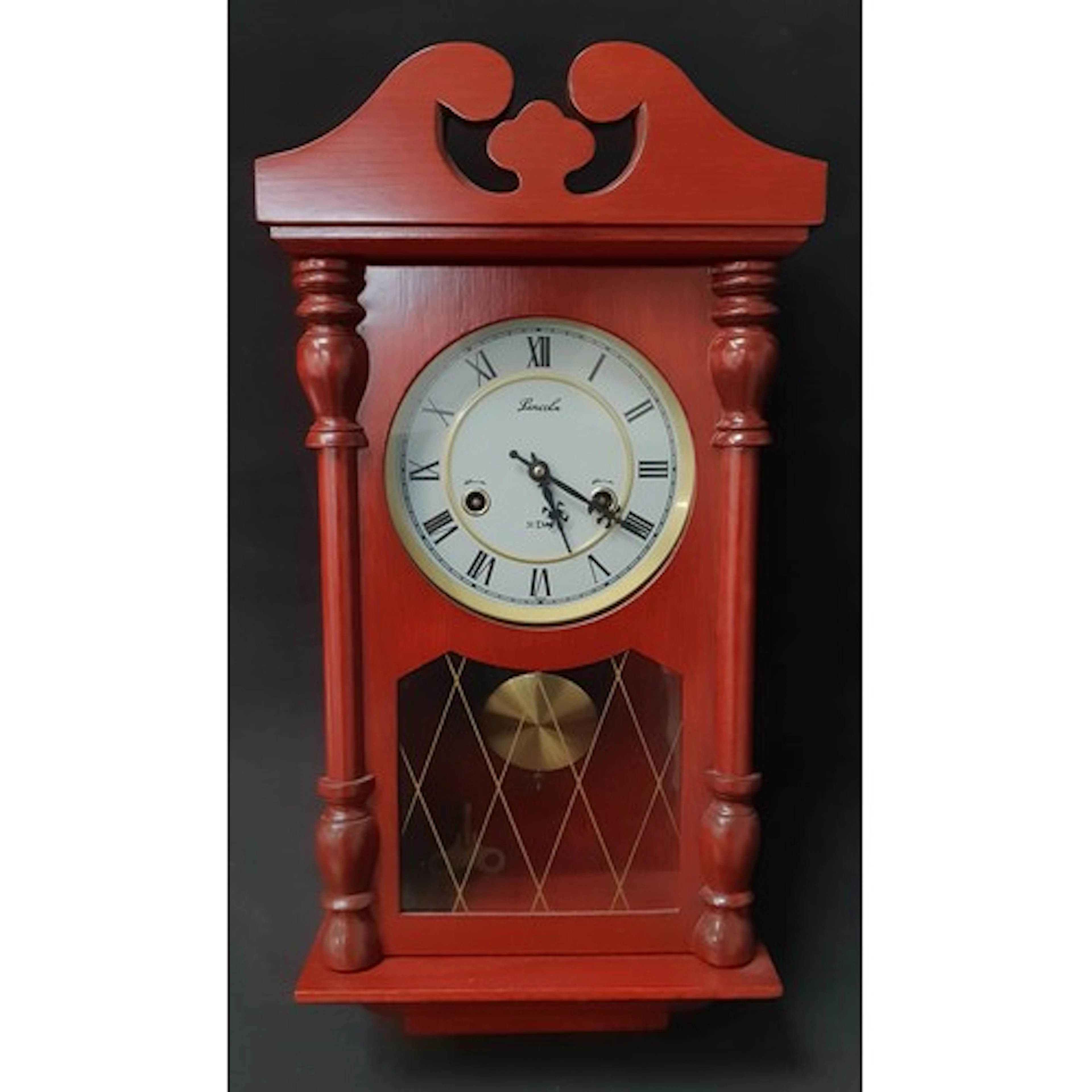 LINCOLN 31 DAY MECHANICAL PENDULUM WALL CLOCK housed in a wo...