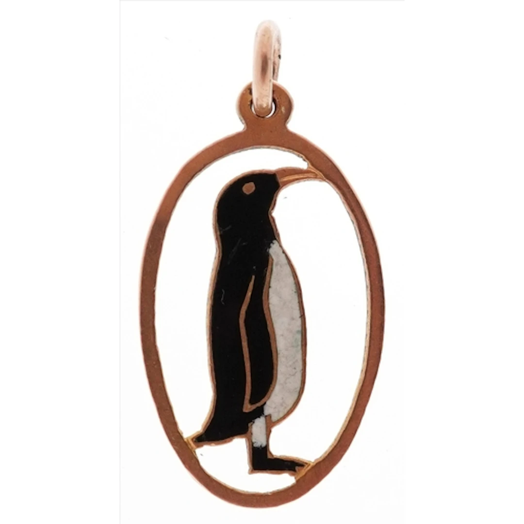 9ct gold and enamel charm in the form of a penguin, 2cm high...